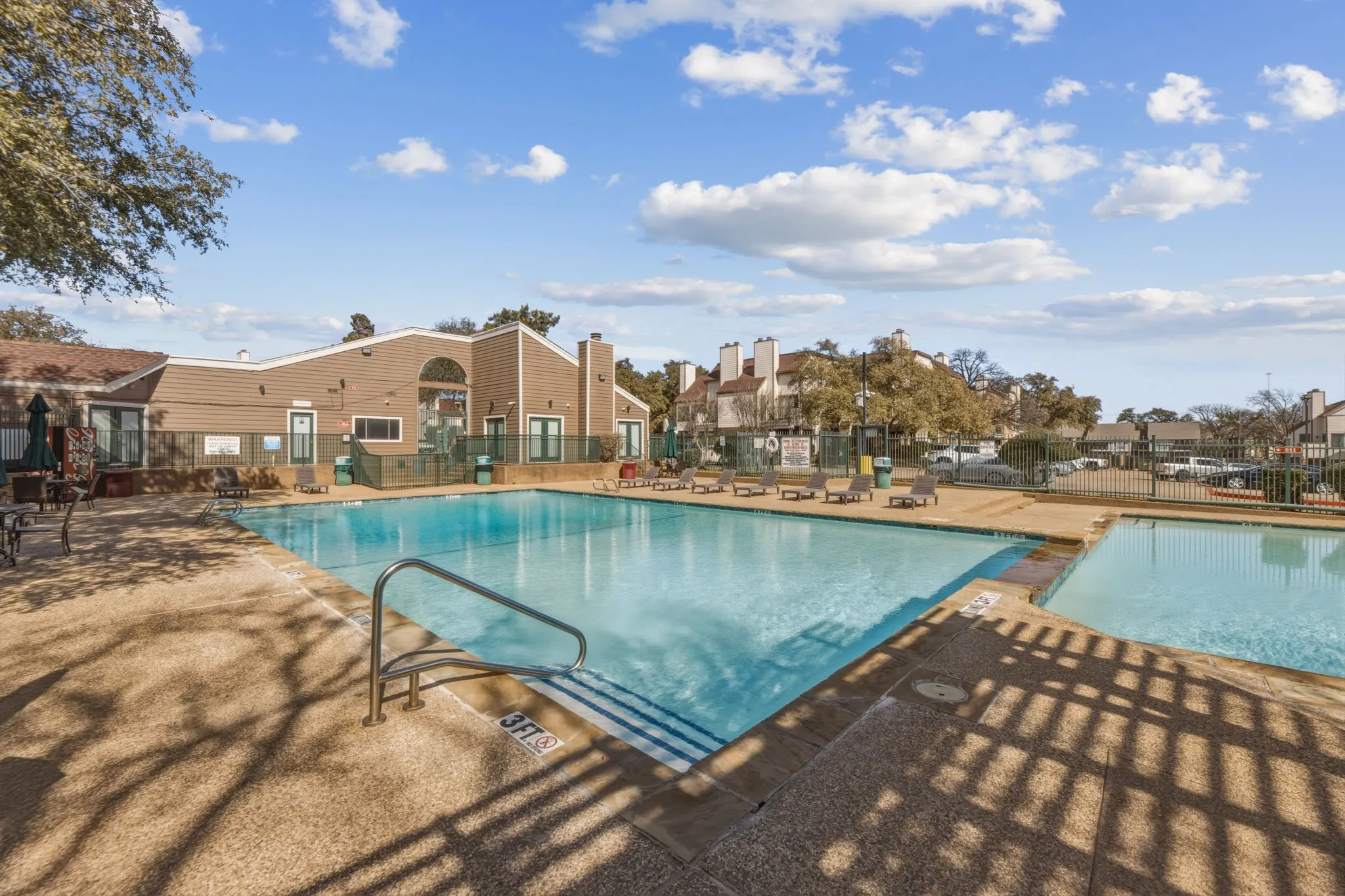 Community pool featuring a patio