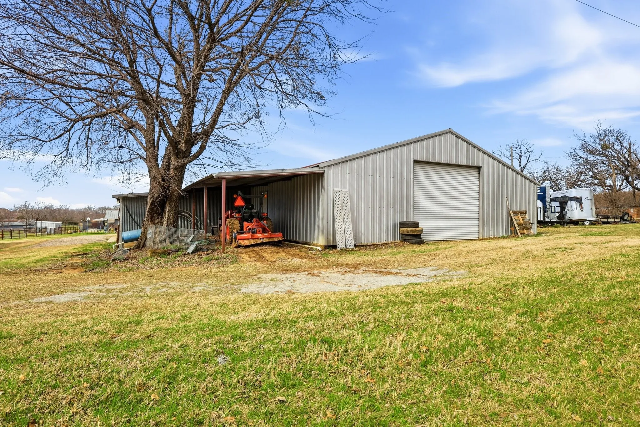 Shop with roll up on backside of barn