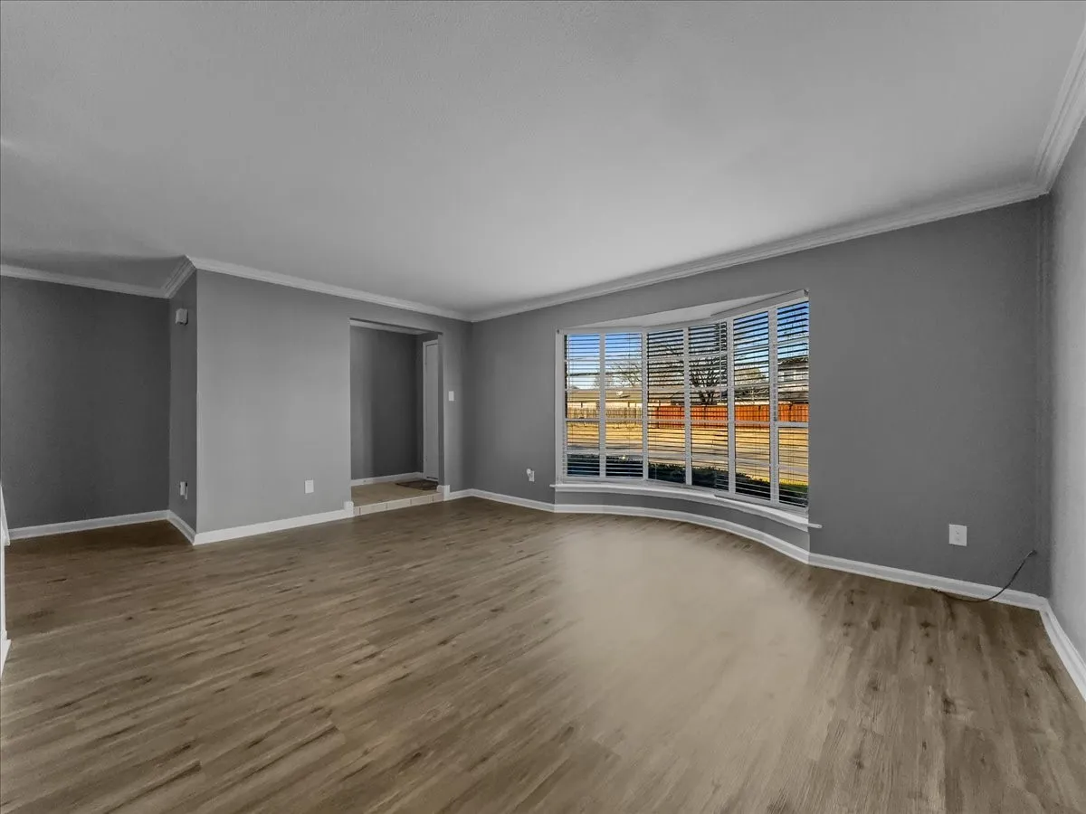 Spacious living area with bay window
