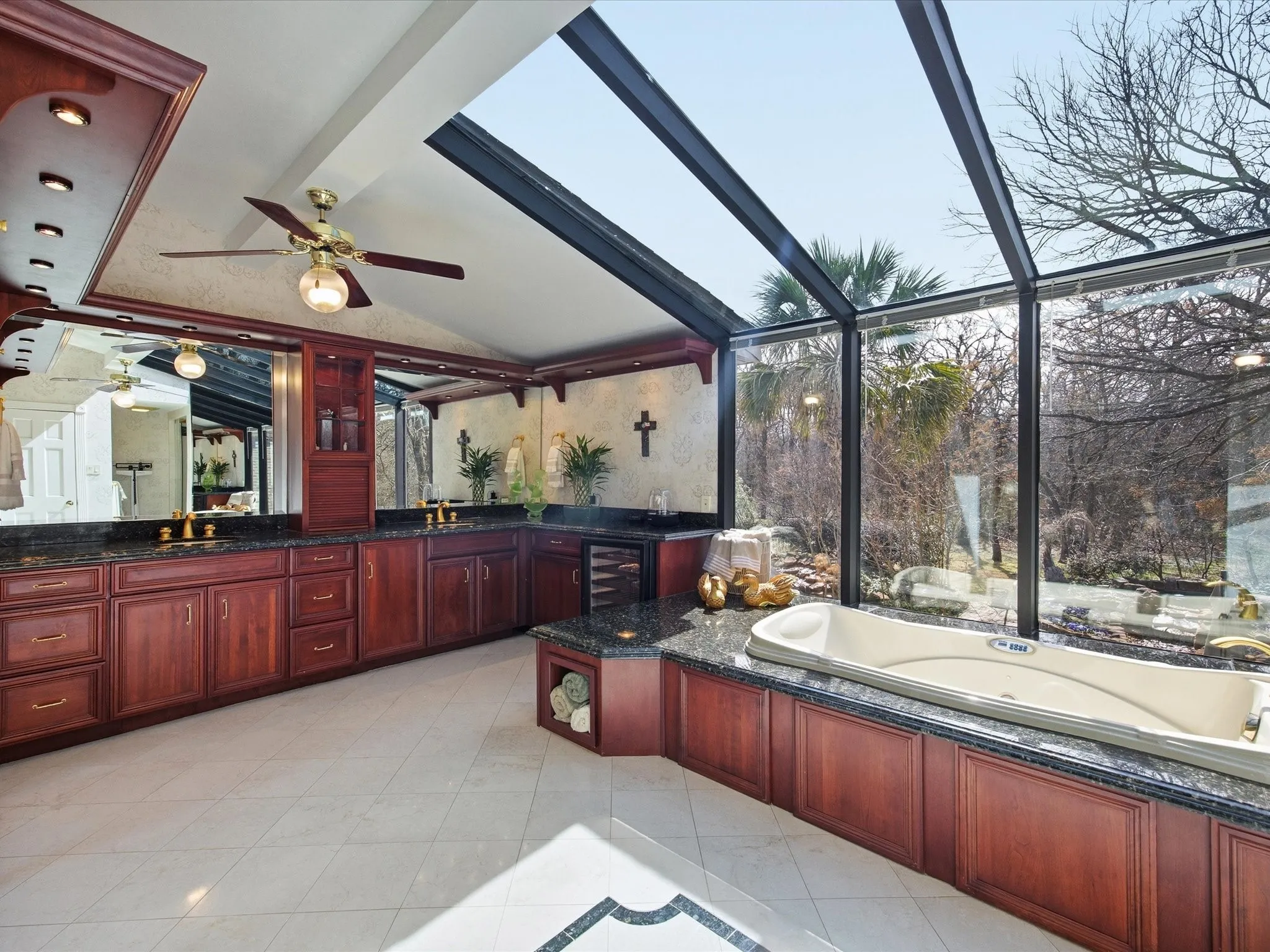 Upstairs Primary Bathroom featuring vanity, beverage cooler, a bath, lofted ceiling, and light tile patterned flooring