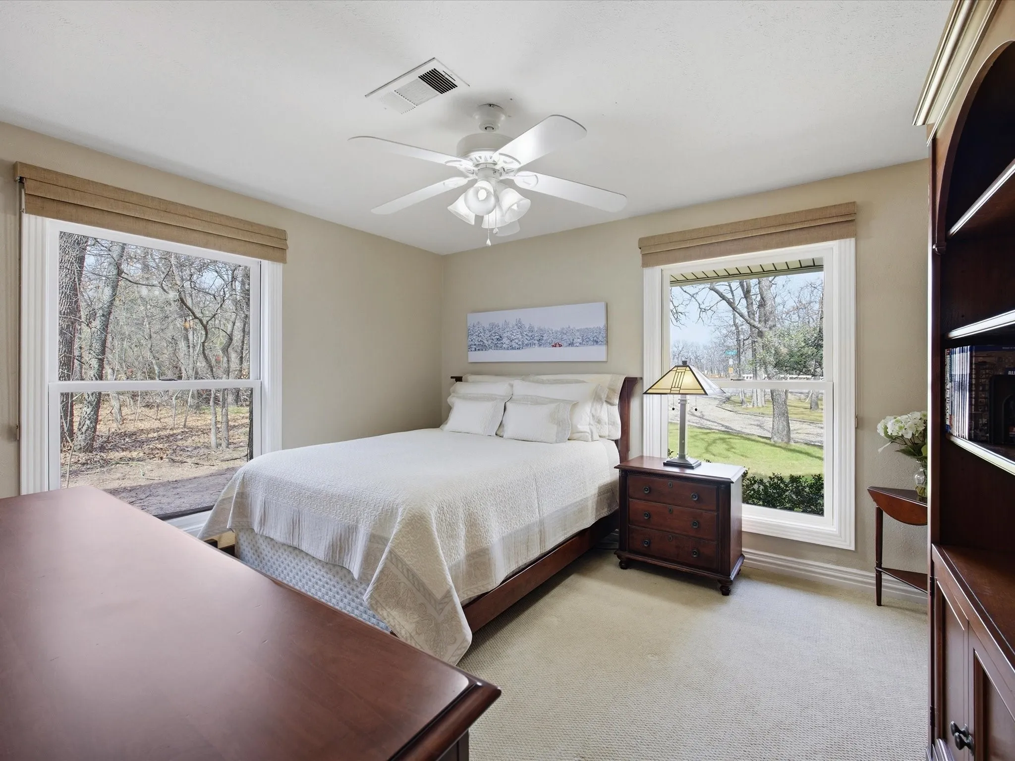 Bedroom featuring light carpet and a ceiling fan