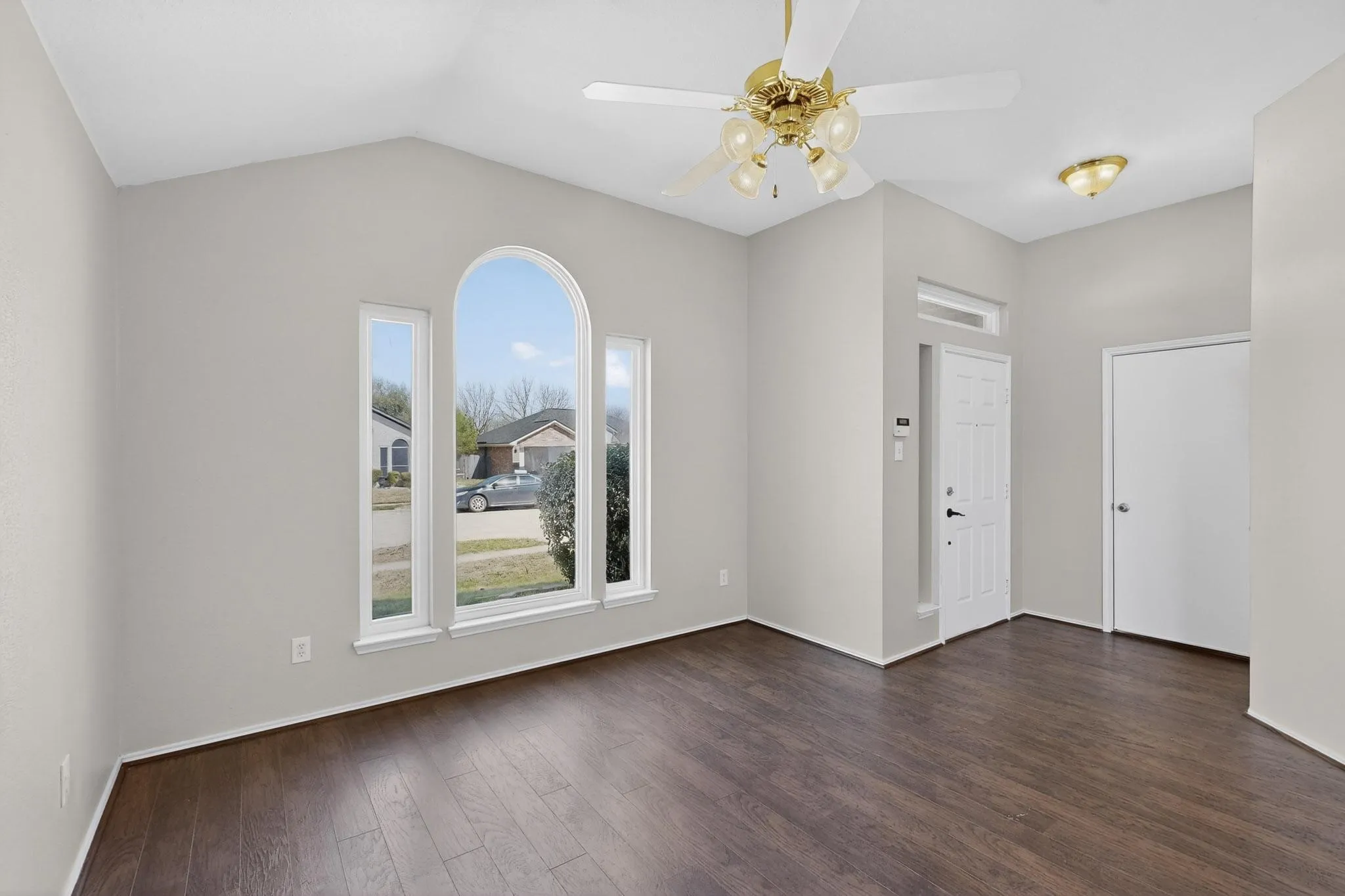 View of front door, garage door.