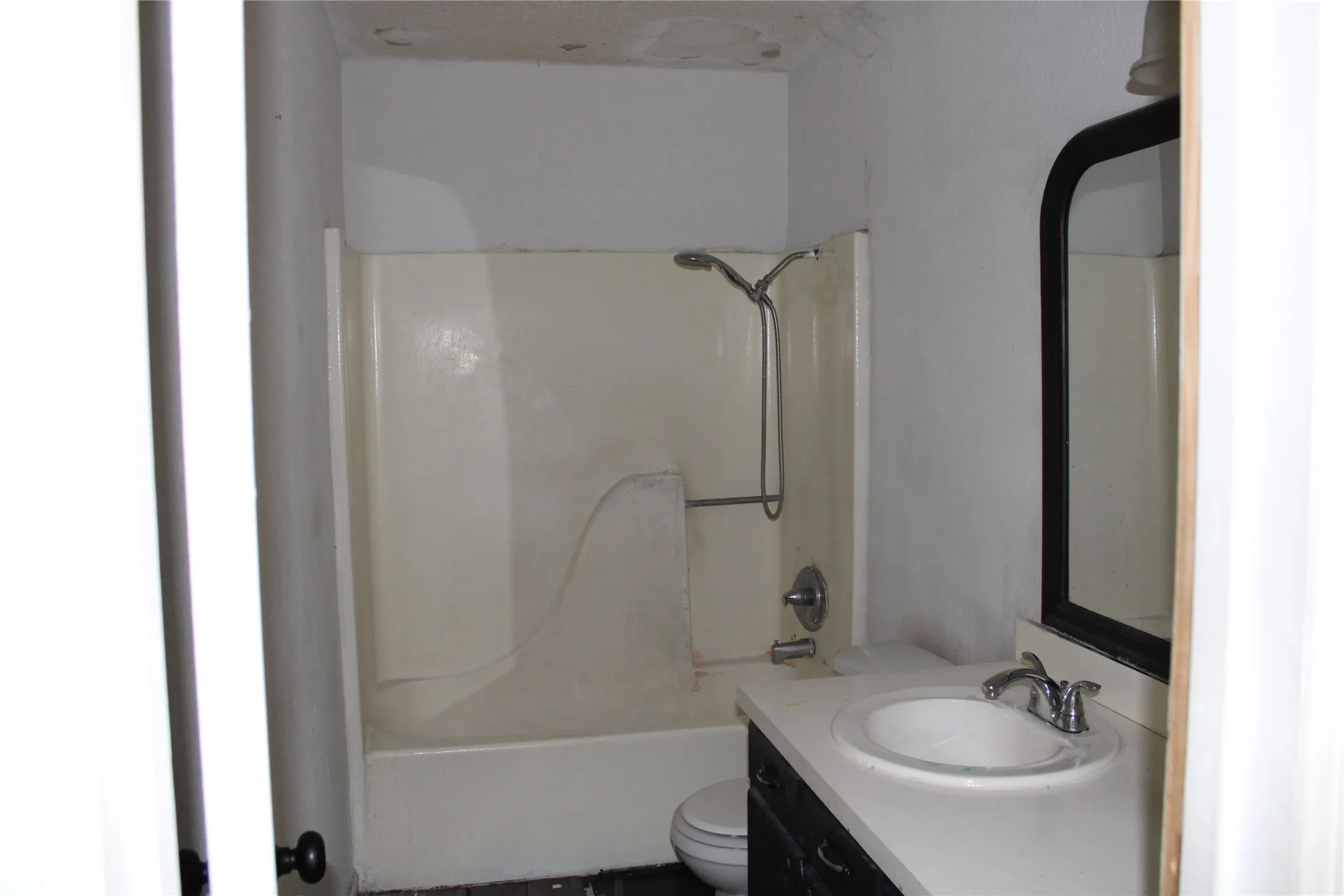 Full bathroom featuring vanity and shower / bathtub combination