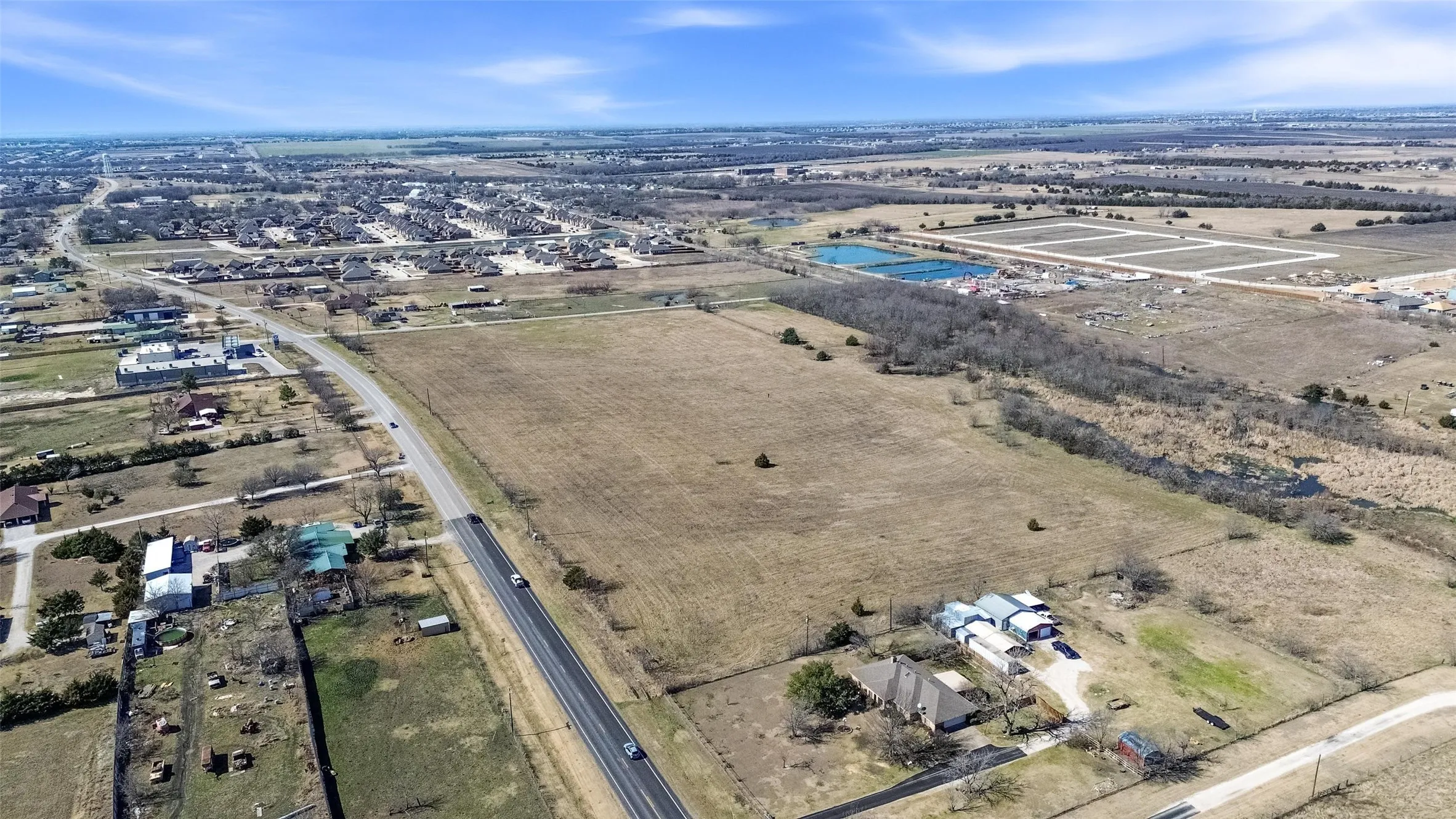 Aerial overview of property's location featuring rural landscape