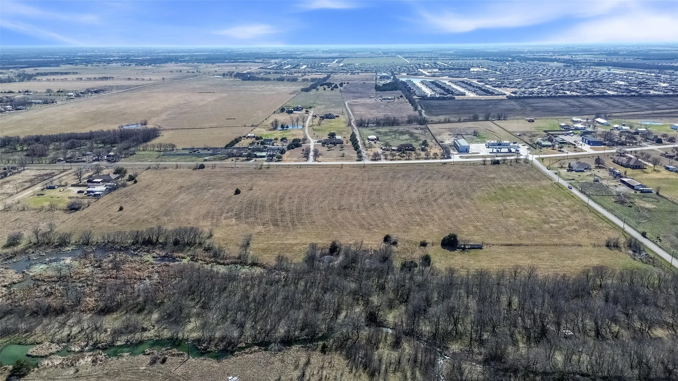 Aerial view of property and surrounding area with rural landscape