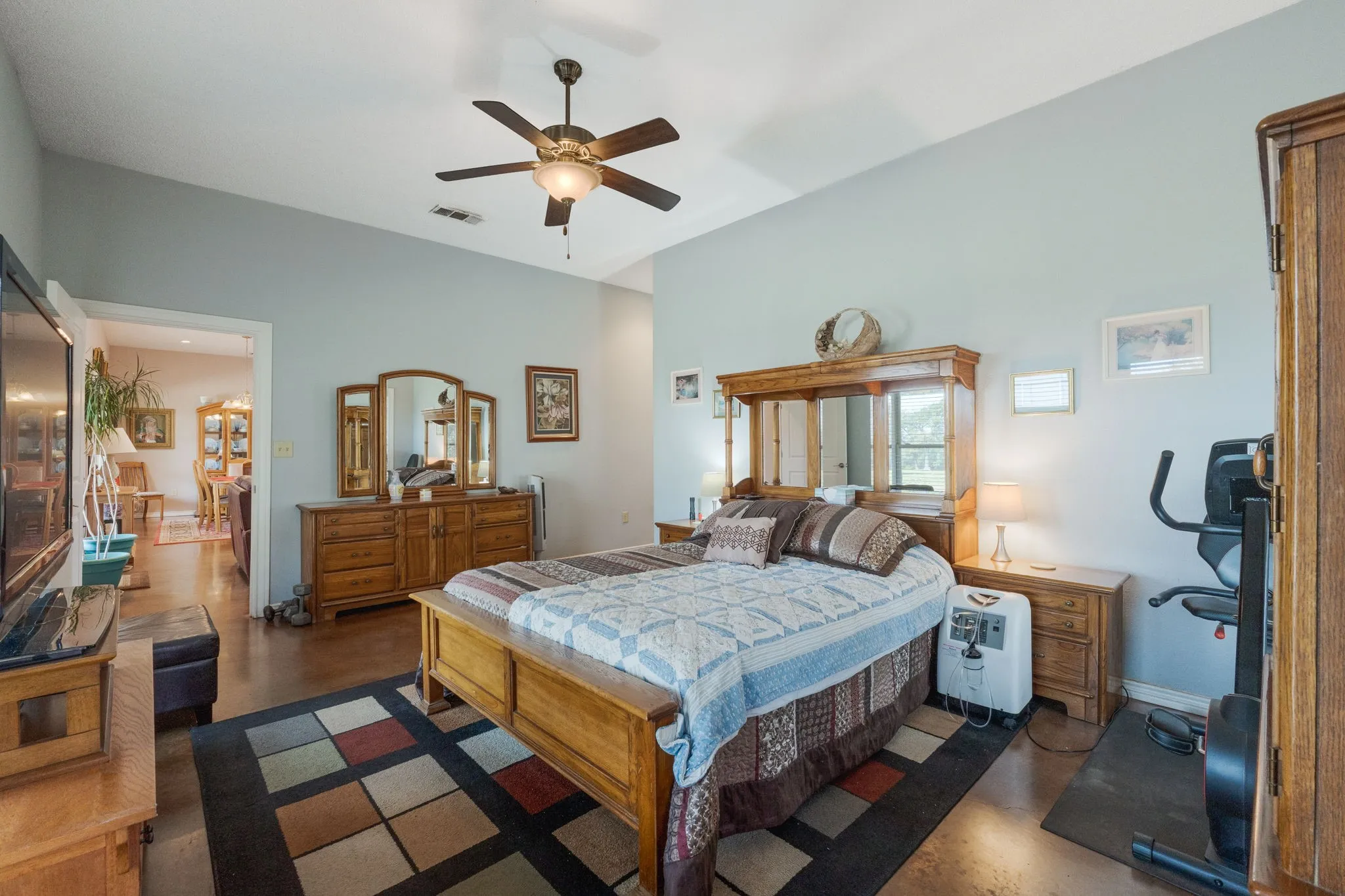 Bedroom with a ceiling fan and baseboards