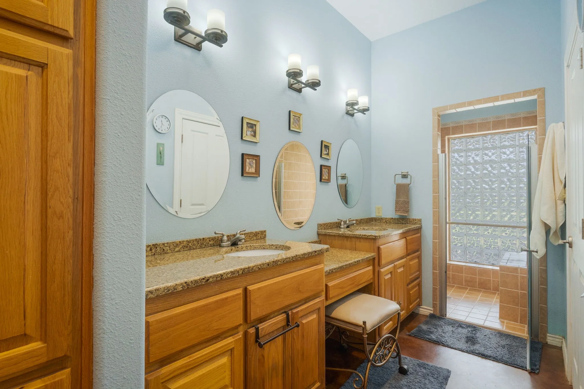 Full bathroom with two vanities and walk in shower