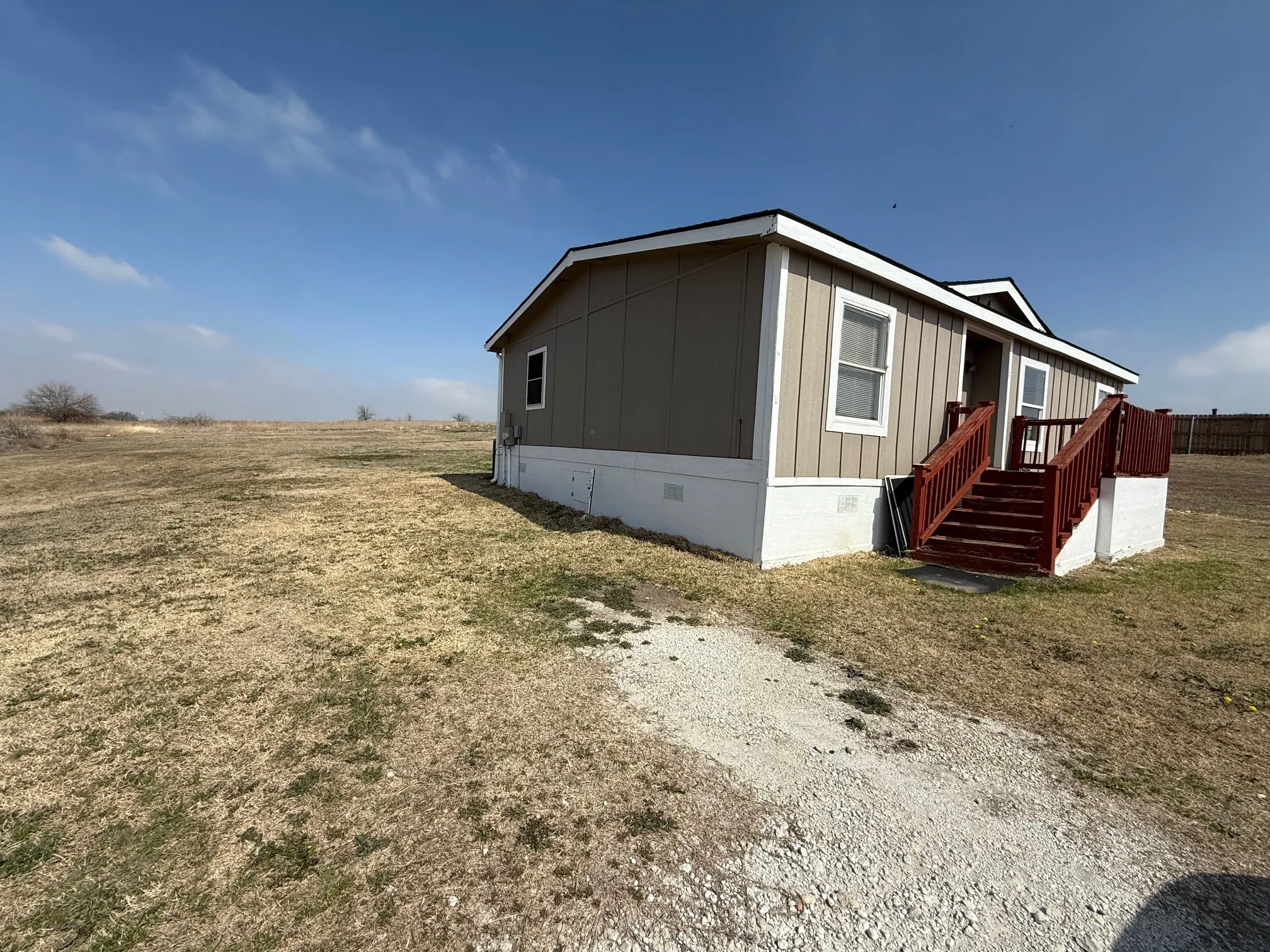 View of property exterior featuring crawl space, a yard, and board and batten​​‌​​​​‌​​‌‌​‌‌​​​‌‌​‌​‌​‌​​​‌​​ siding