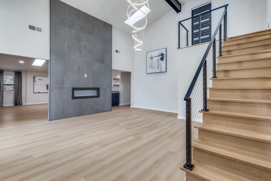 To your left the floor to ceiling wall has a see through fireplace