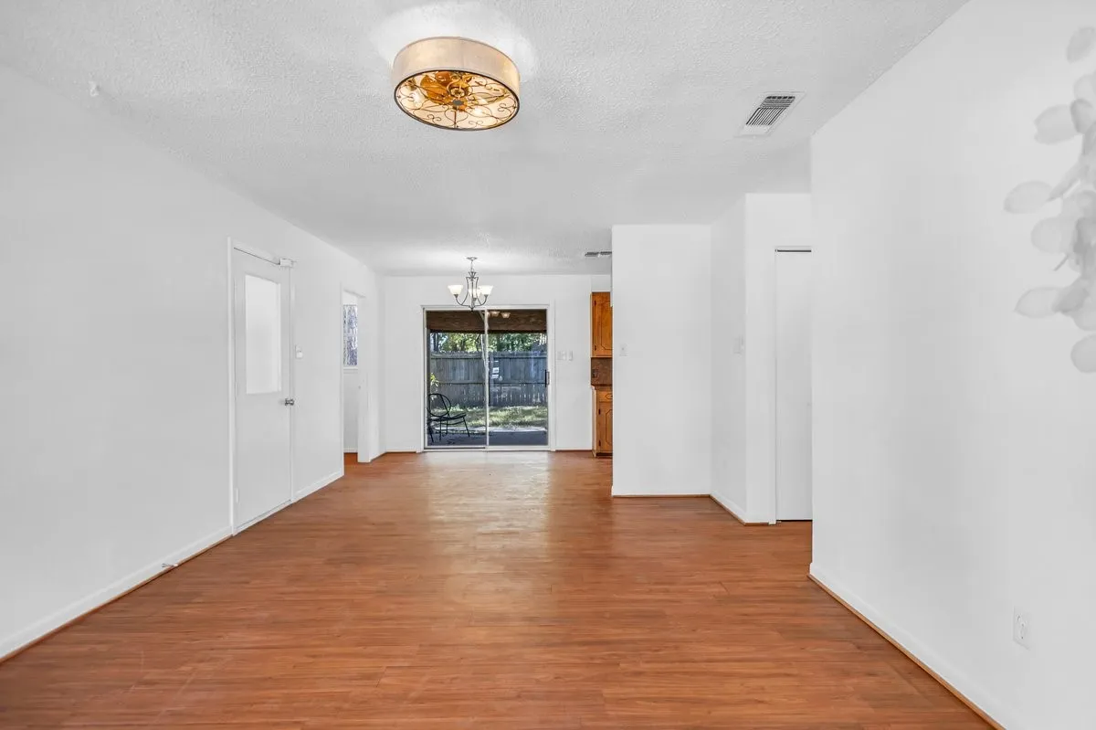 Your view as you walk through the front door. Bealuiful floors. Freshly painted, and new light fixtures.