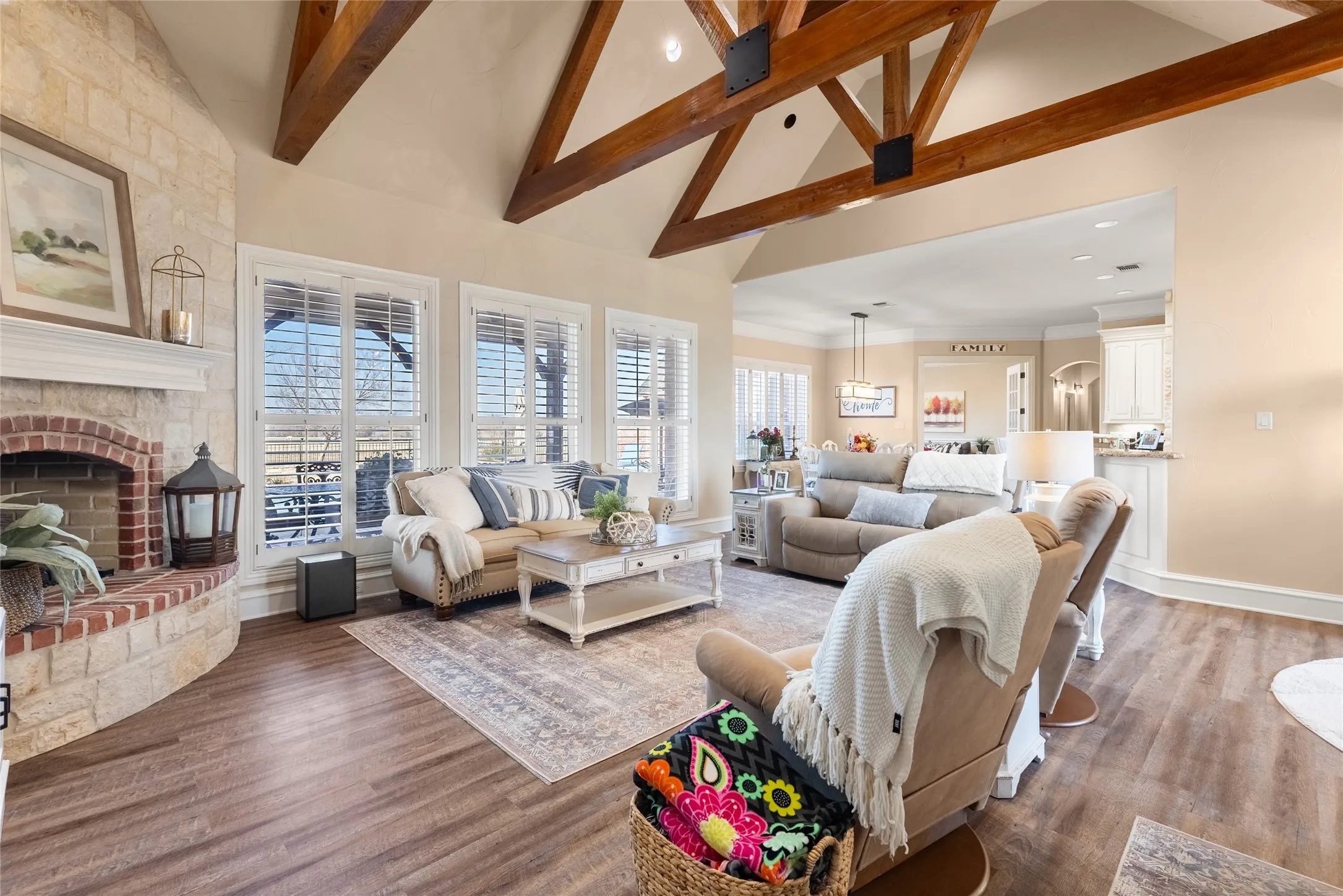 Living room with a fireplace and wood finished floors