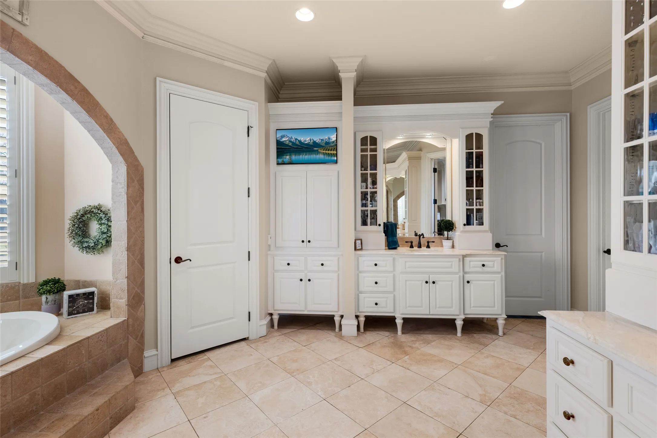 Bathroom with vanity, crown molding, a bath, recessed lighting, and light tile patterned flooring
