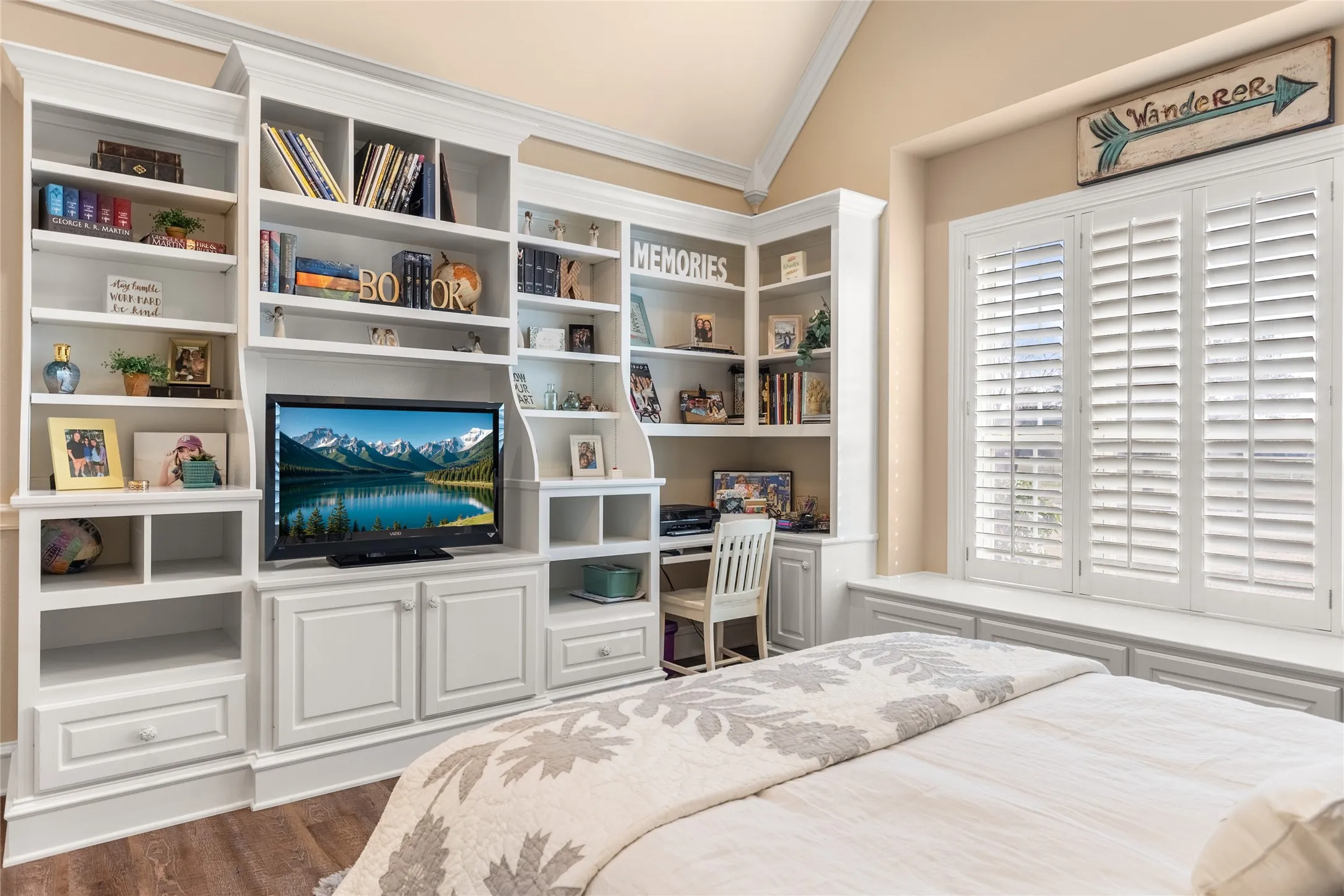 Bedroom featuring vaulted ceiling, ornamental molding, and dark wood finished floors