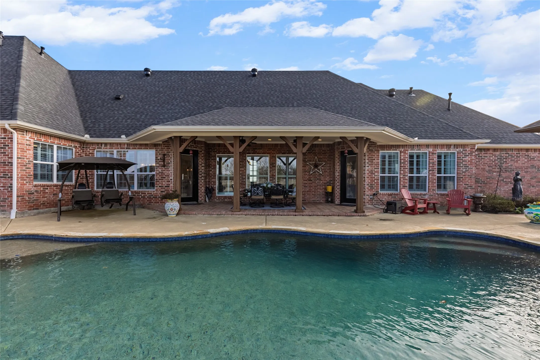 Outdoor pool featuring a patio area