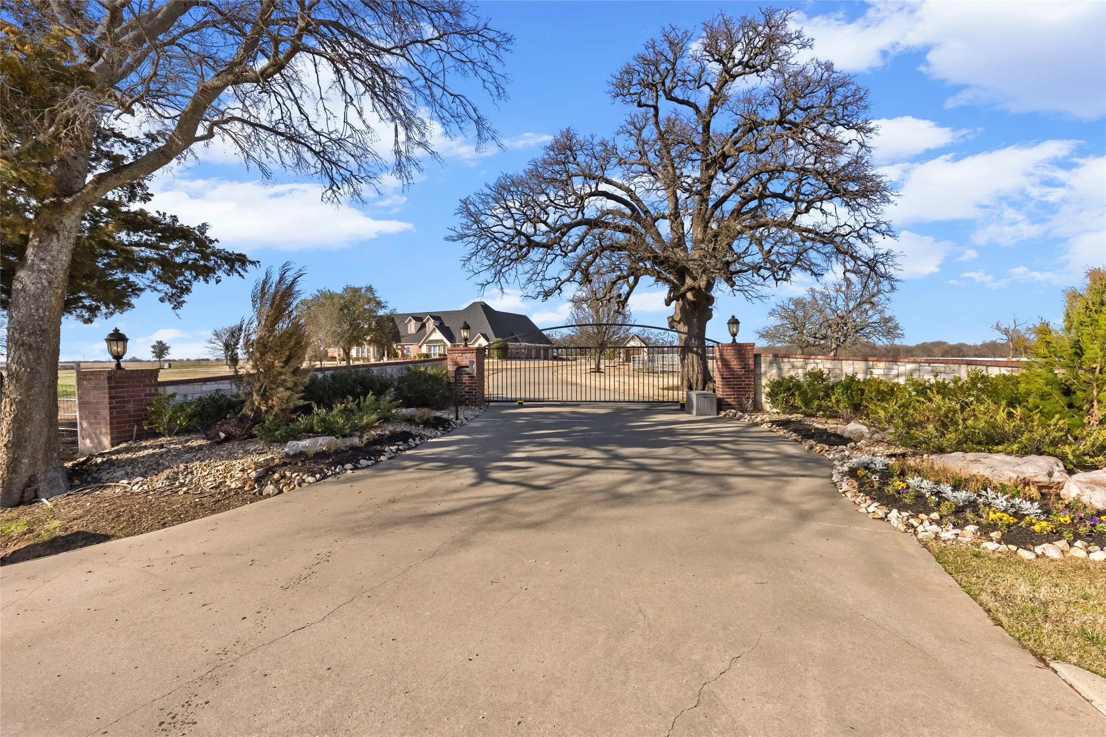 View of concrete surface with a gate and a gated entry