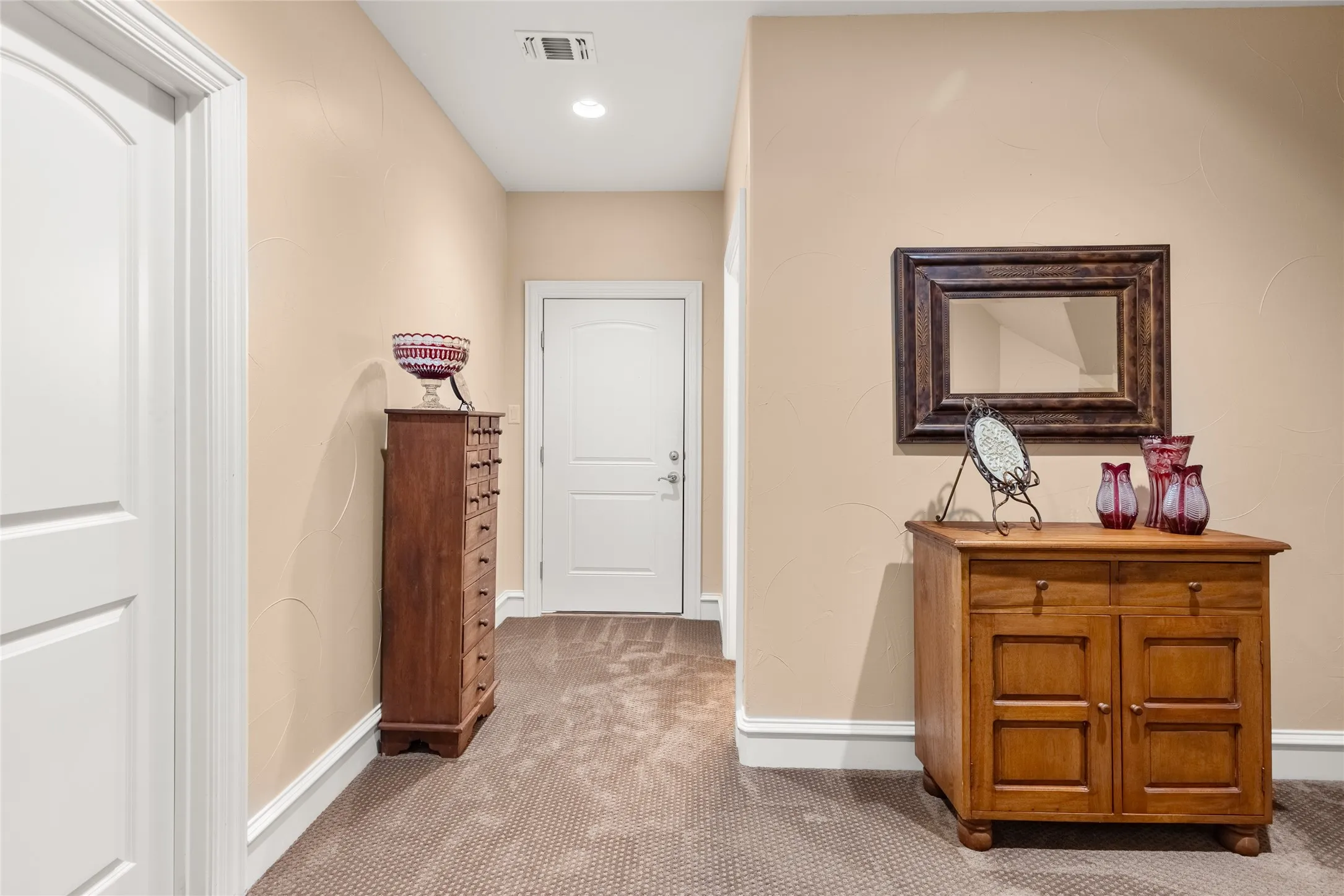 Hallway featuring carpet flooring and recessed lighting