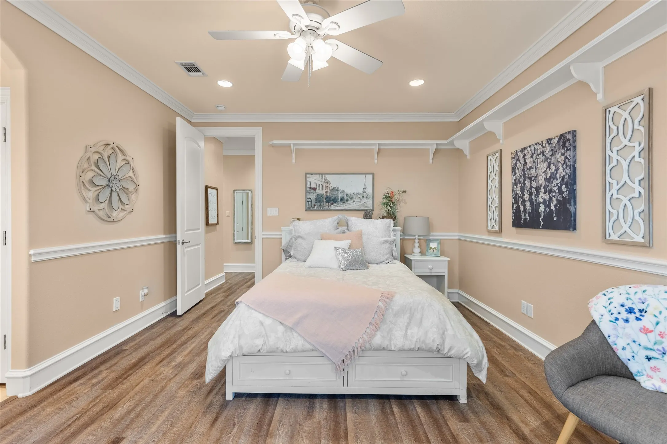 Bedroom featuring recessed lighting, wood finished floors, crown molding, and a ceiling fan