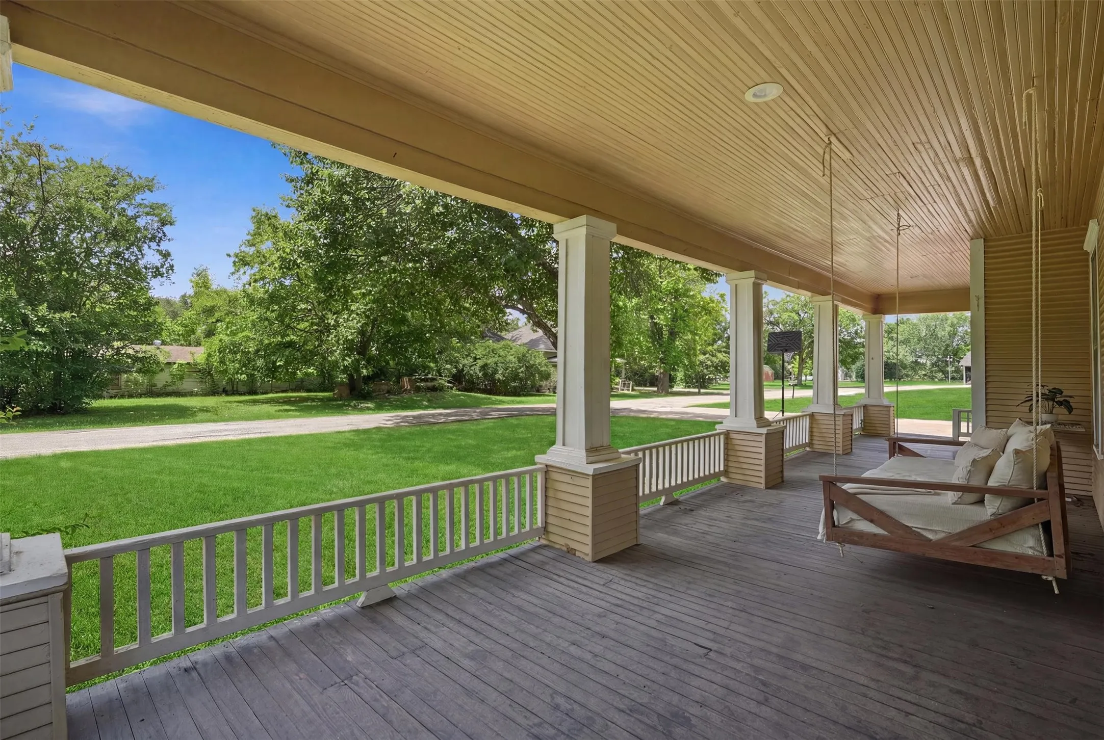 Beautiful Wrap around porch with hanging swing