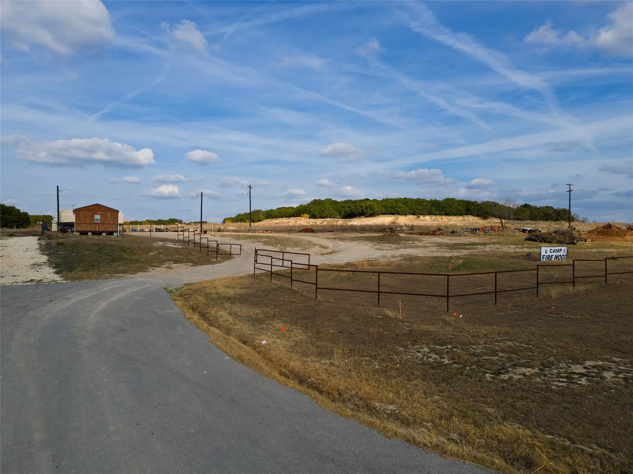 View of asphalt road featuring a view of rural / pastoral area