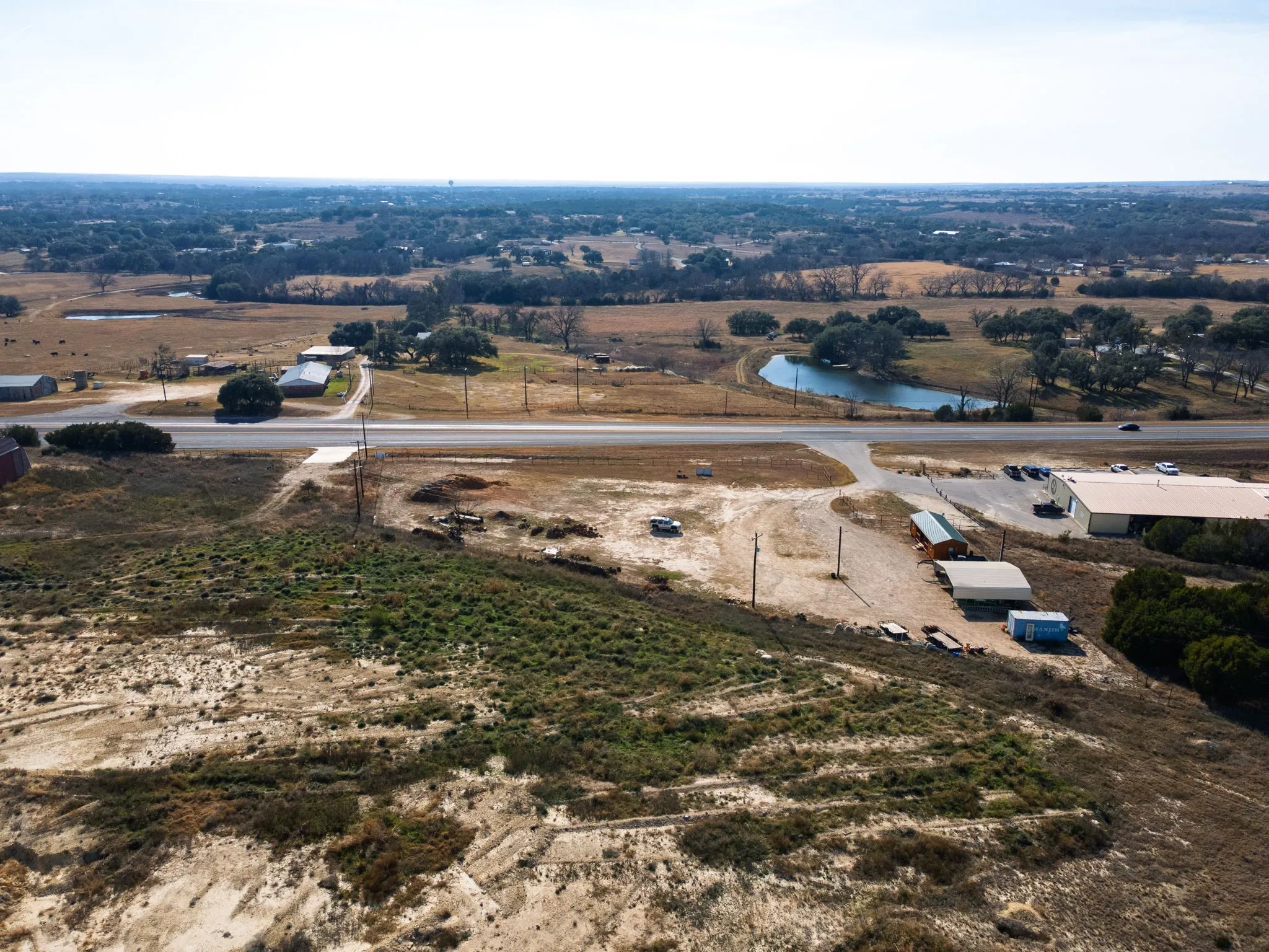 Overview of rural landscape with a nearby body of water