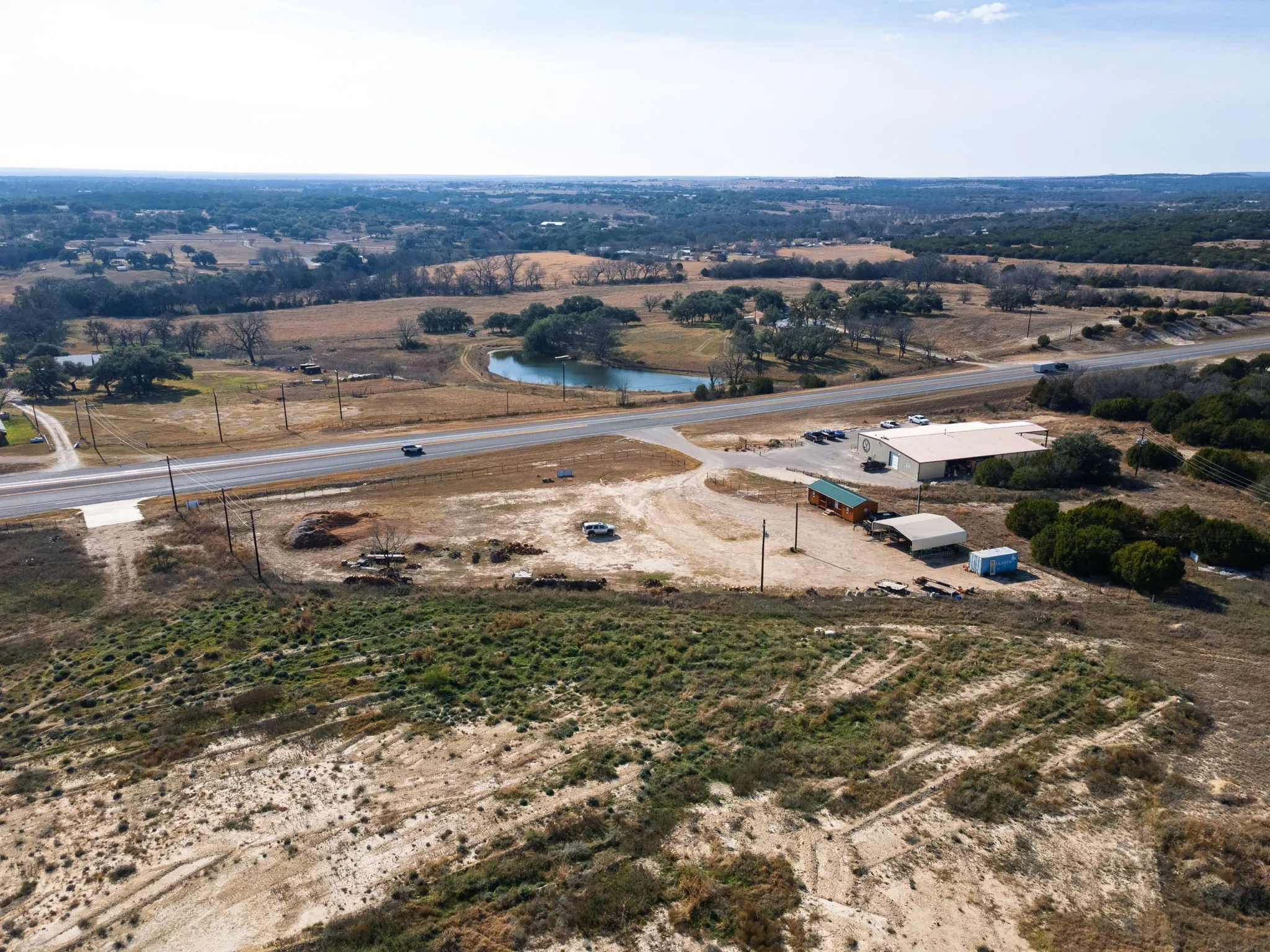 Overview of rural landscape with a nearby body of water