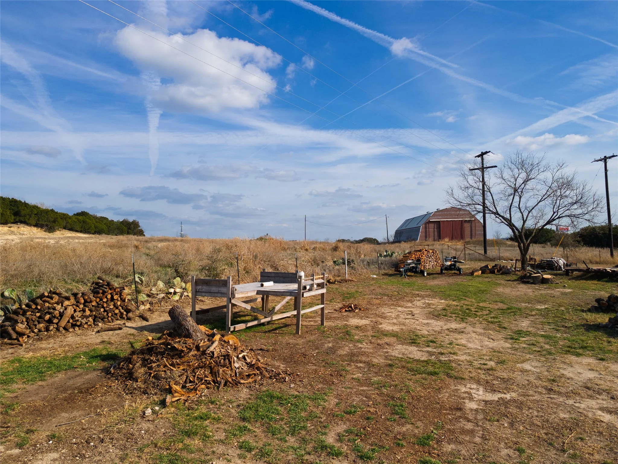 View of yard with a barn, an outdoor structure, and a view of countryside