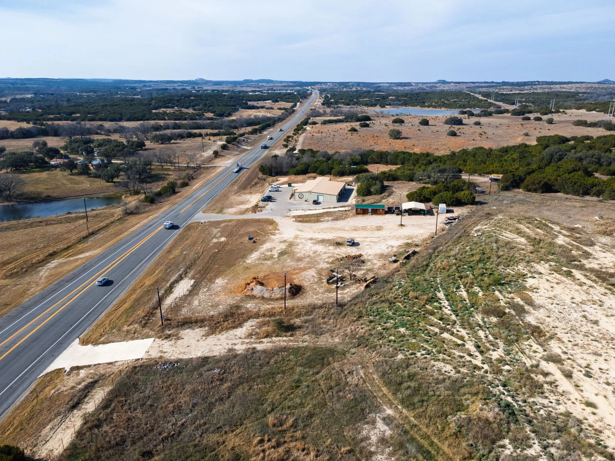 Overview of rural landscape featuring a nearby body of water