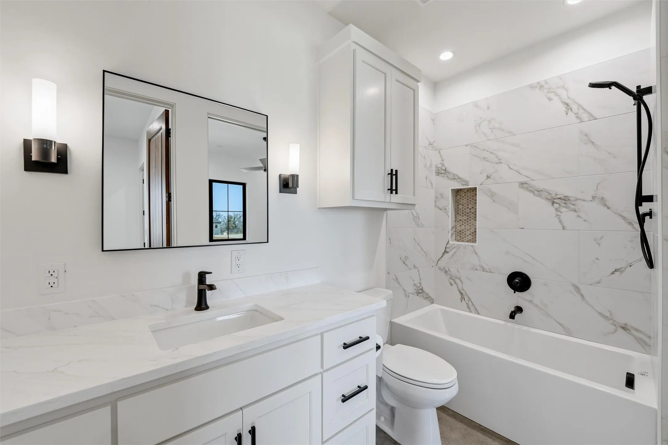 Bathroom featuring vanity and  shower combination