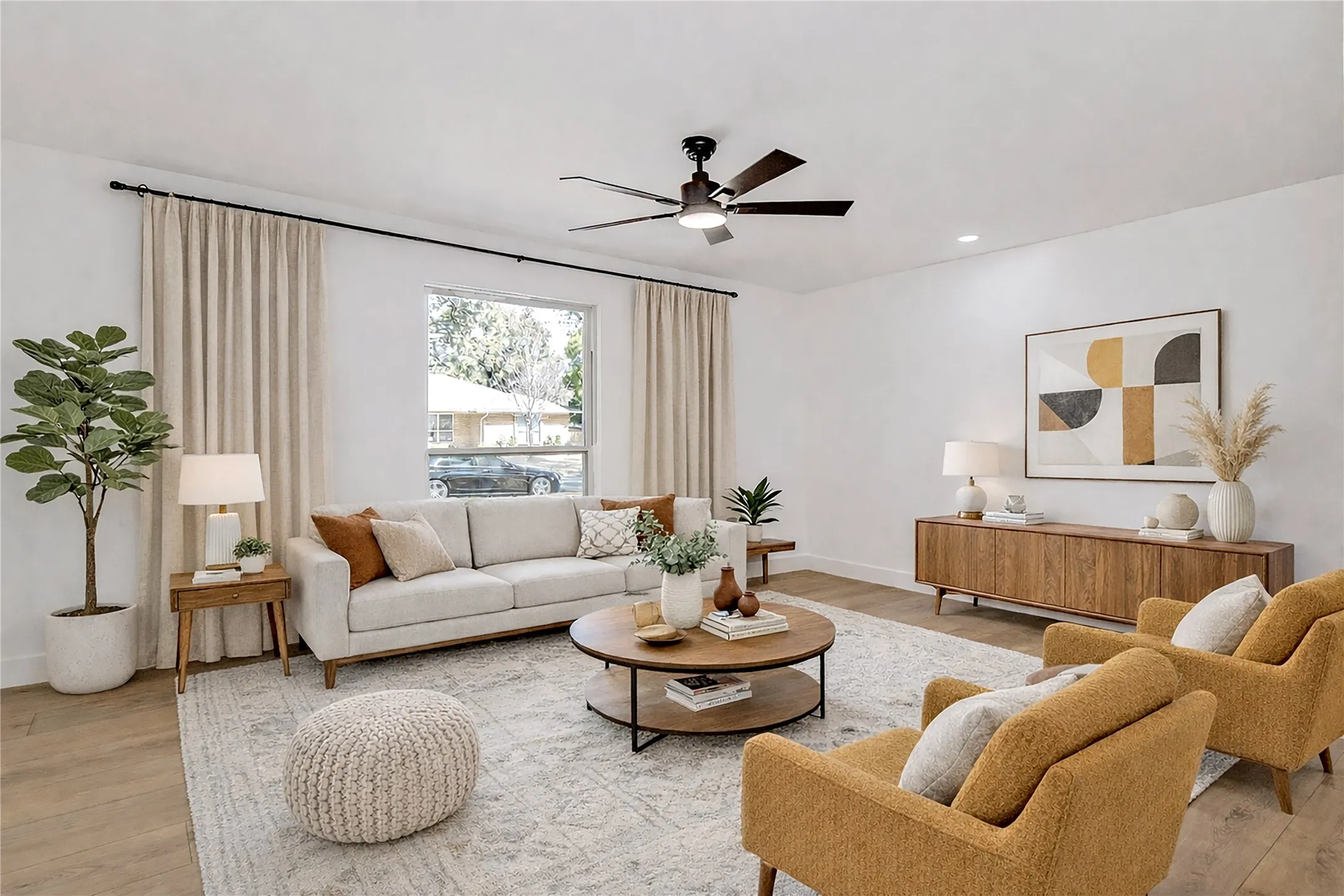 Family room featuring a ceiling fan, light wood-type flooring, and recessed lighting.  Virtual staged photo