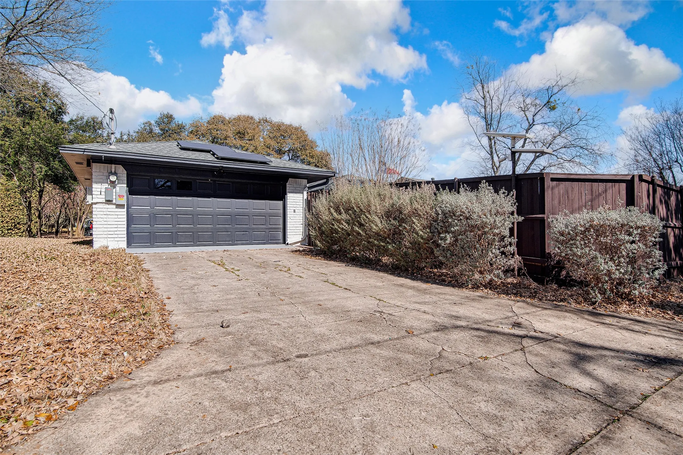 Detached garage featuring roof mounted solar panels