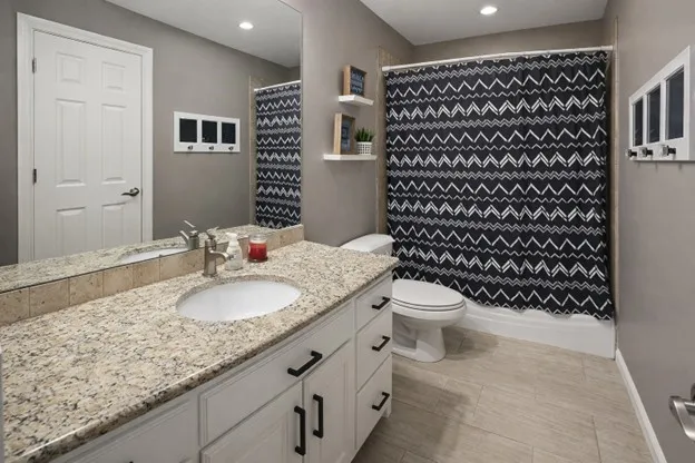 Second hallway takes you to a full bathroom and two additional bedrooms with walk in closets.