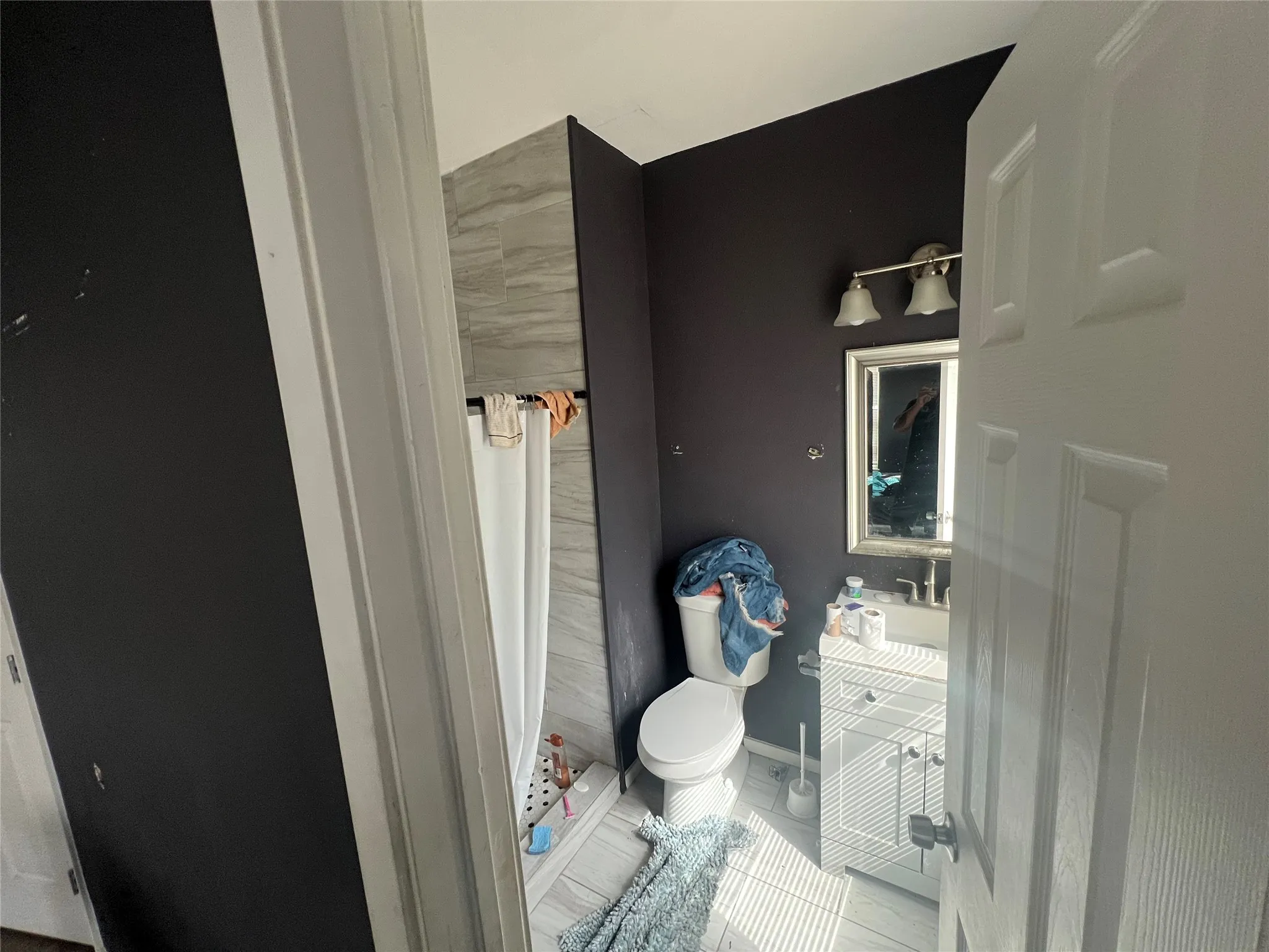 Bathroom with vanity and a shower with curtain