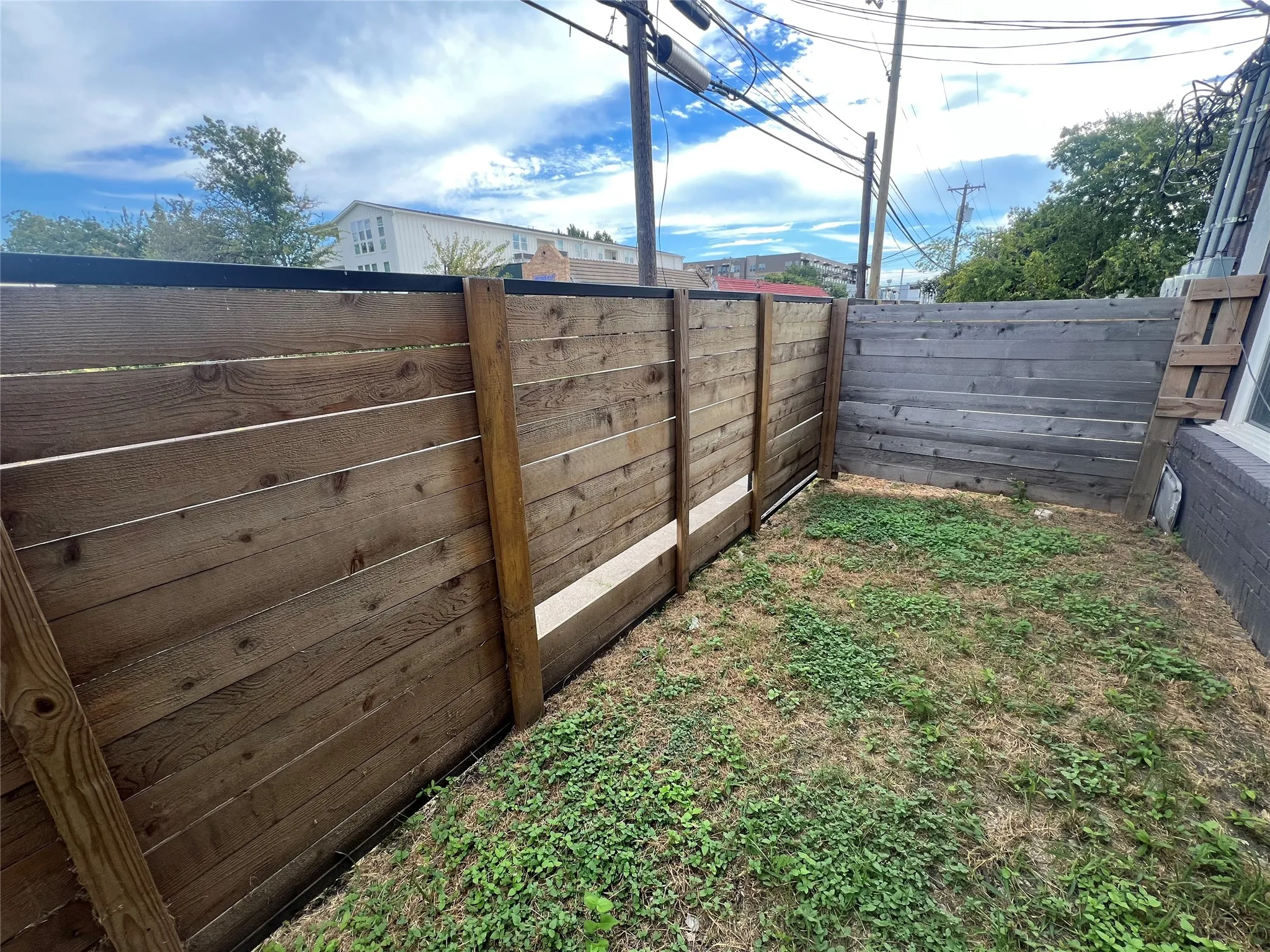 View of fenced backyard