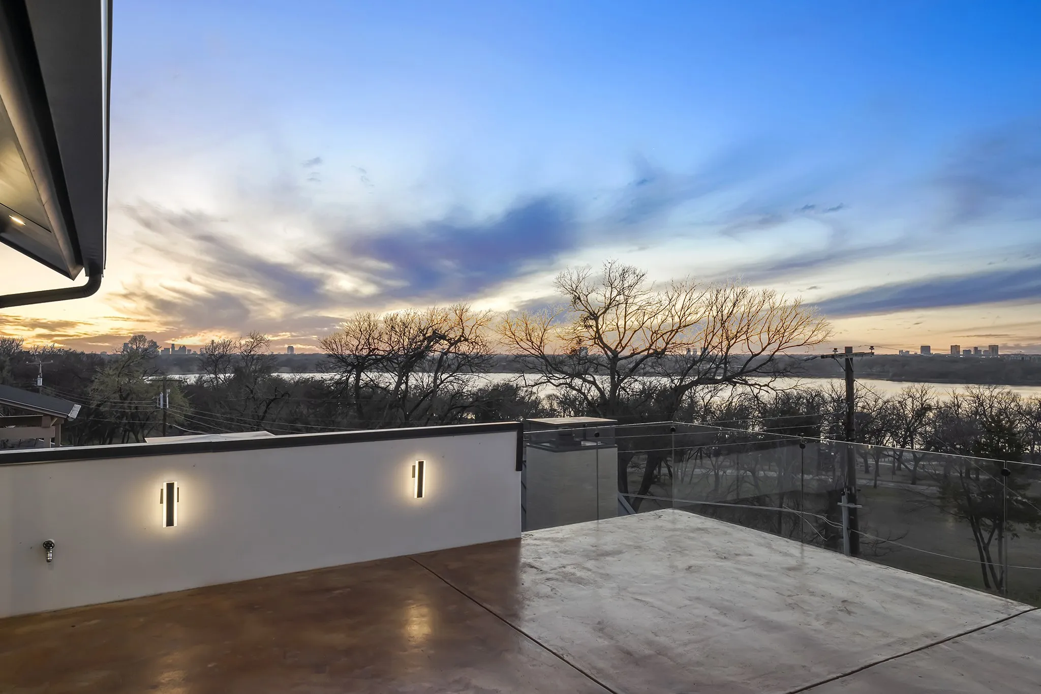Rooftop terrace with glass rails - your front-row seat to White Rock Lake and the downtown Dallas skyline