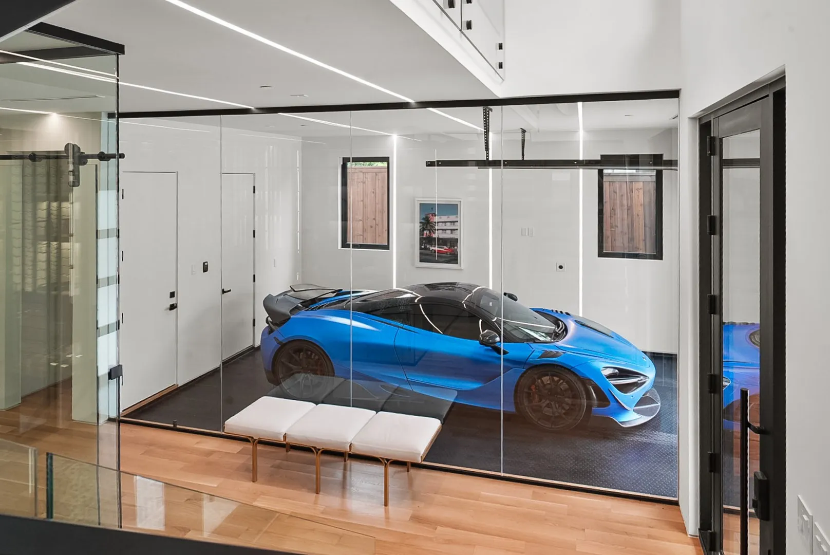 Glass-enclosed showroom garage - display your favorite car like art