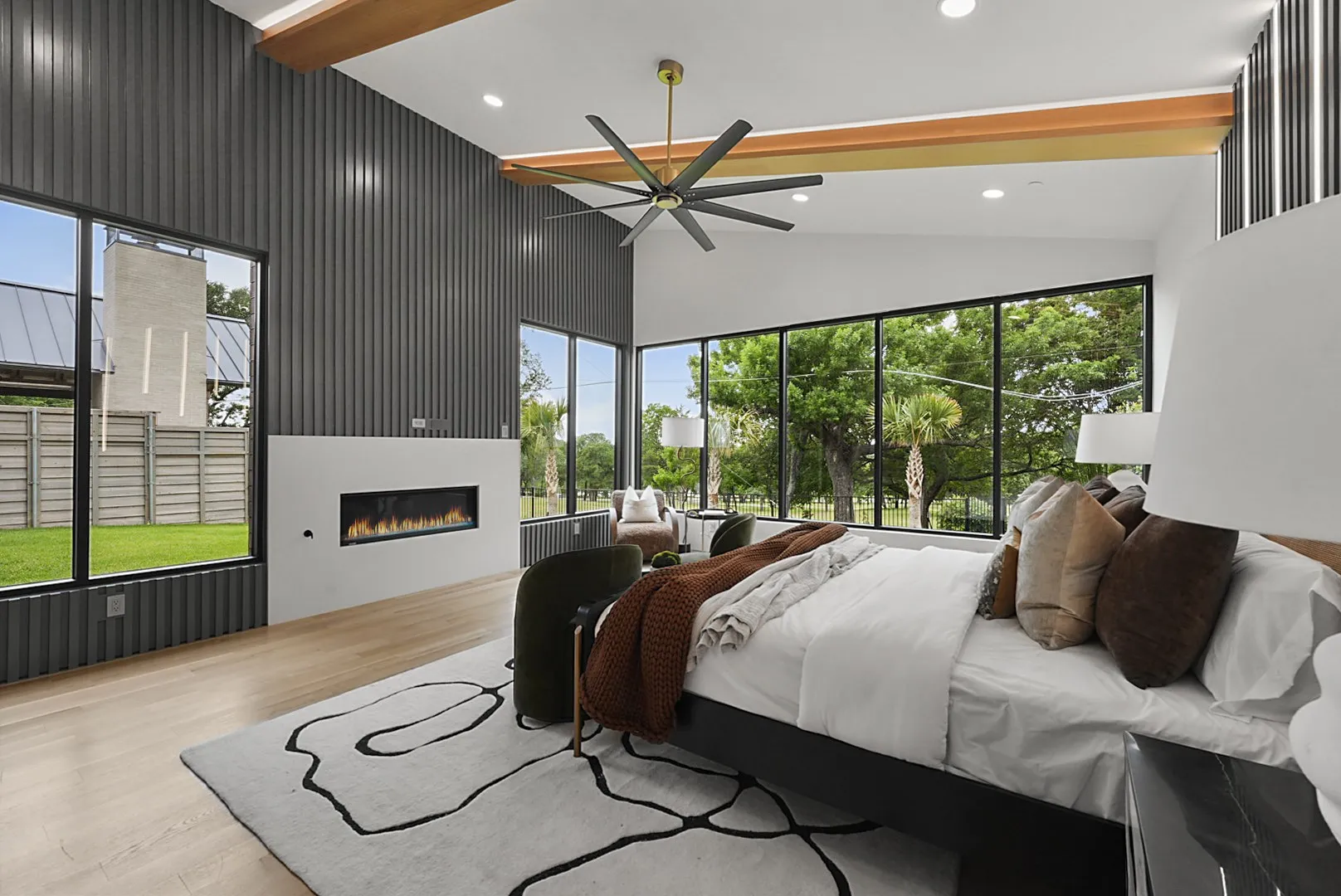 Primary suite under vaulted wood-beamed ceilings - with a direct, unobstructed view of White Rock Lake