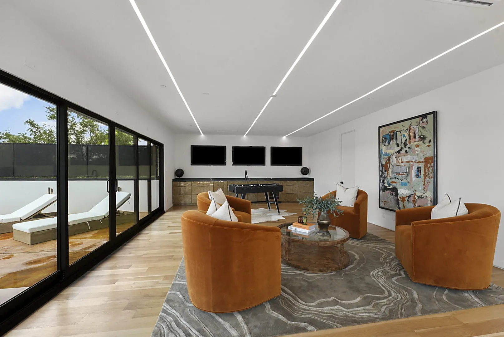 Flexible entertainment space ready for game tables or a home gym