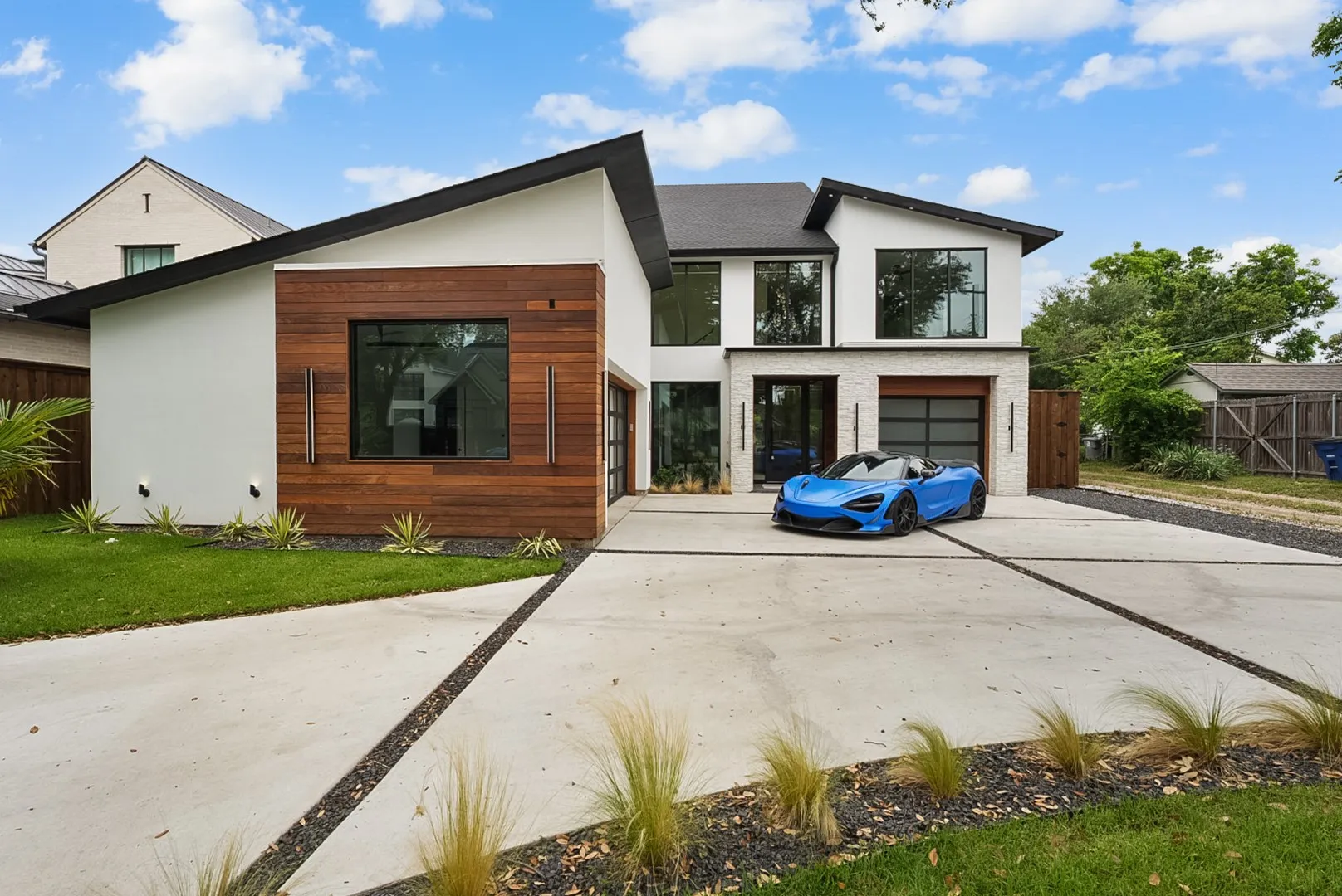 Clean contemporary lines and rich wood accents make an unforgettable first impression