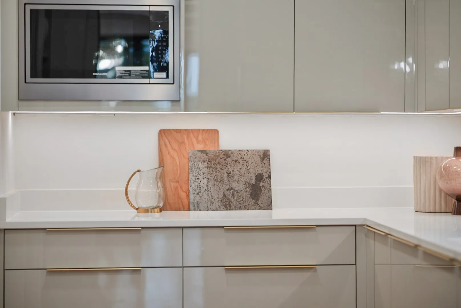 Sleek chef's kitchen in glossy cabinetry - plus a separate full prep kitchen