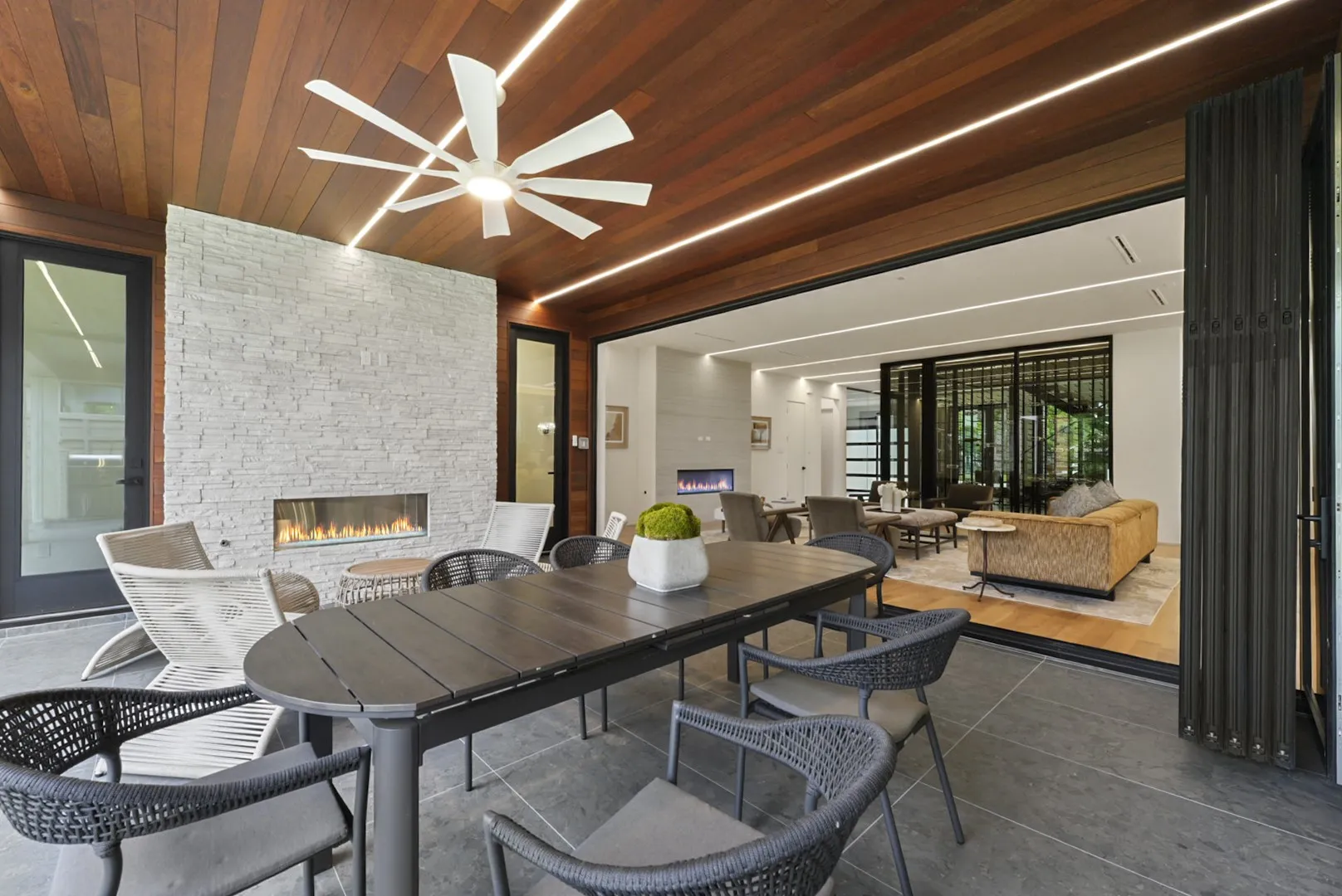 Covered patio with paneled wood ceiling - dine al fresco year-round