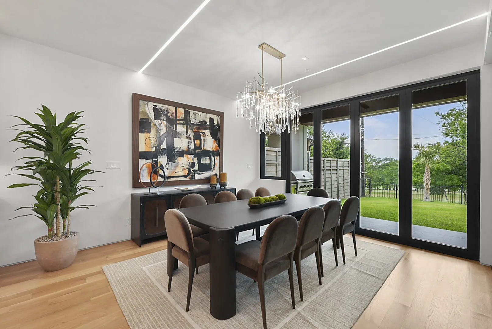 Dining with a direct lake view - the wall of sliding glass frames the water at every meal