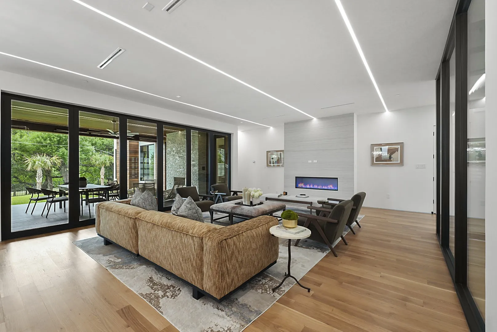 Sculptural linear fireplace anchors the family room