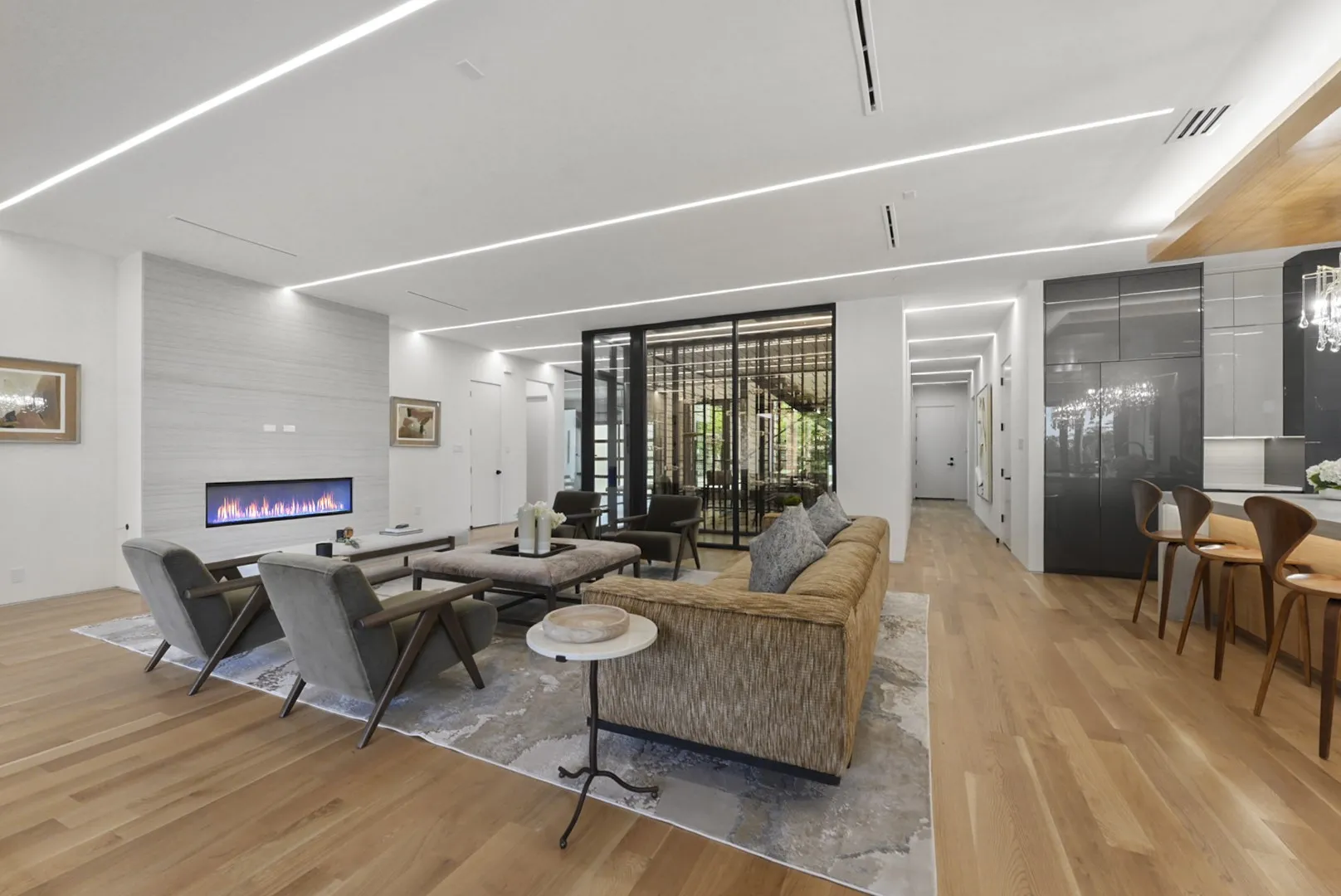 Wide-open living spaces in warm white oak tones