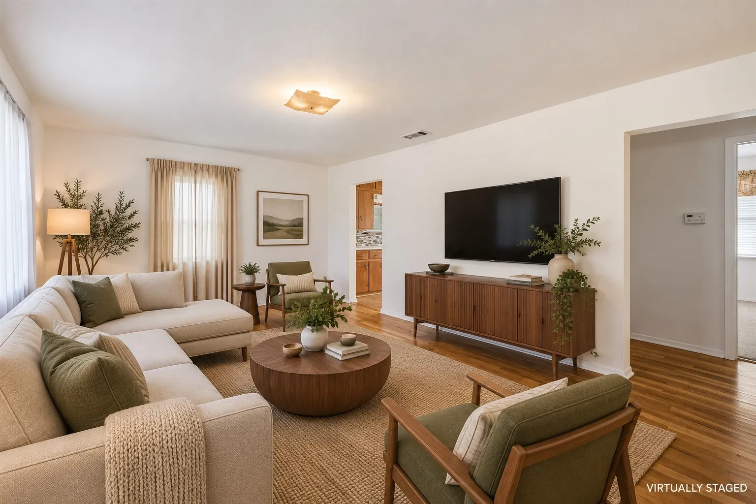 Hardwood flooring throughout, recessed lighting, and a neutral color palette