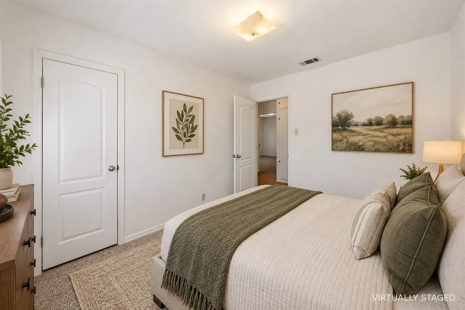 Plush carpeting, interior paneled doors, and a ceiling-mounted light fixture