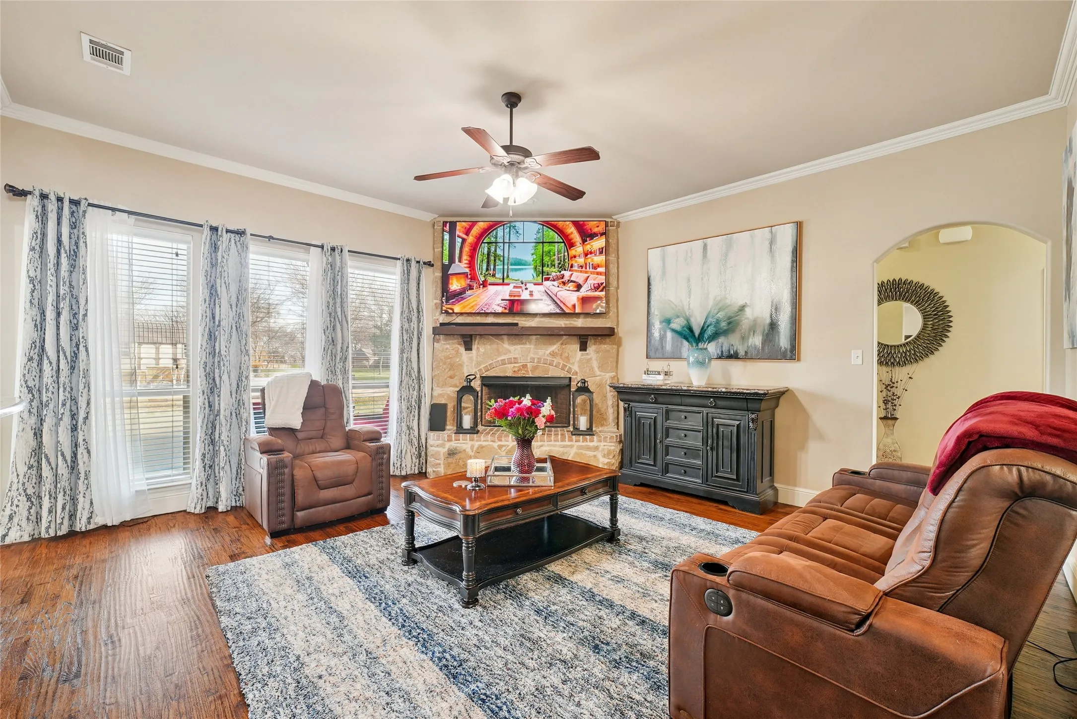 Bright living room filled with natural light and beautiful pool views.