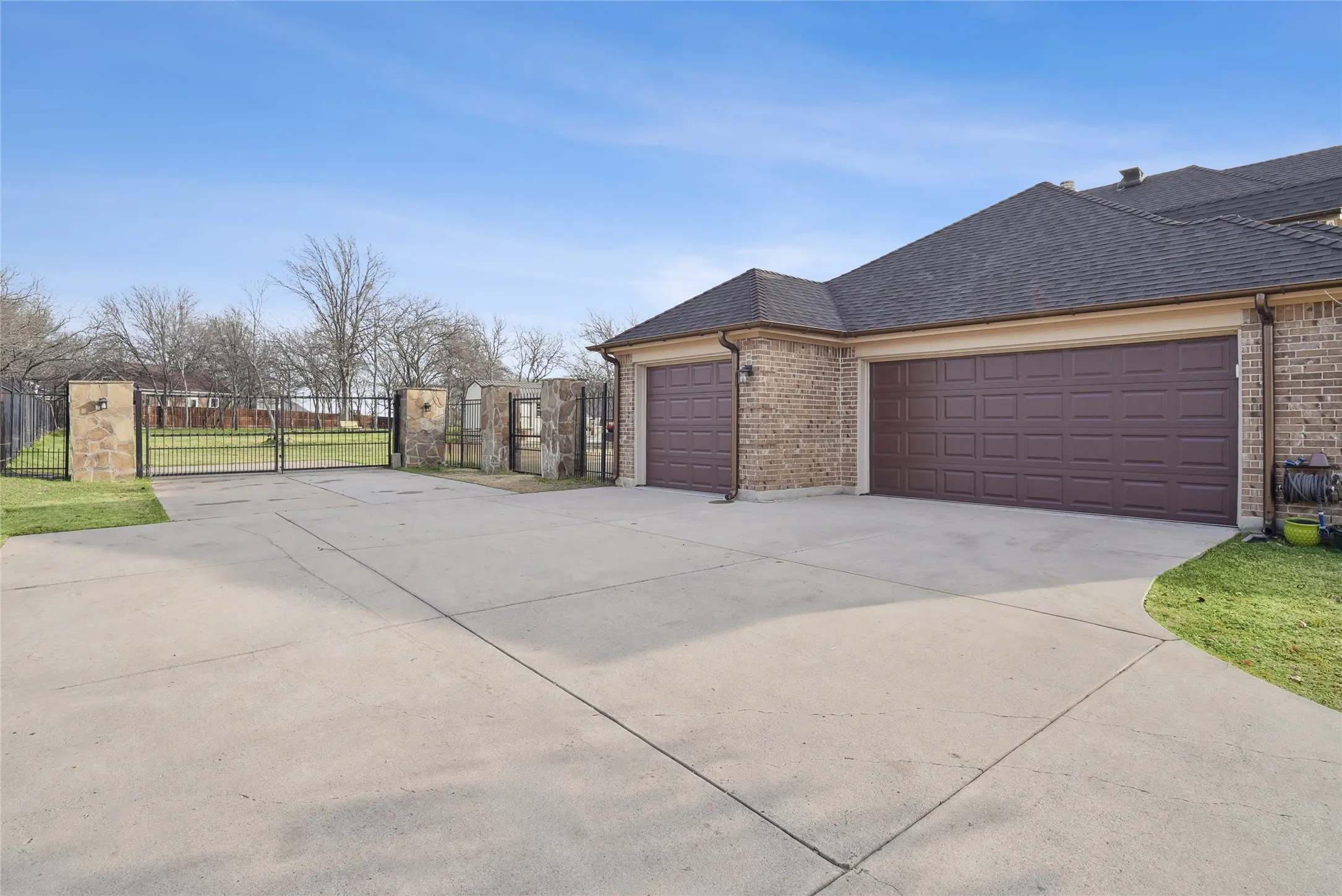 3 Car Garage with electric gate.