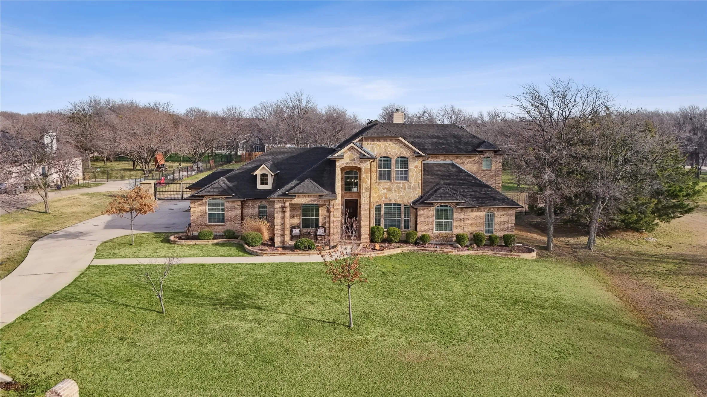 expansive front lawn with potential for a circular driveway.
