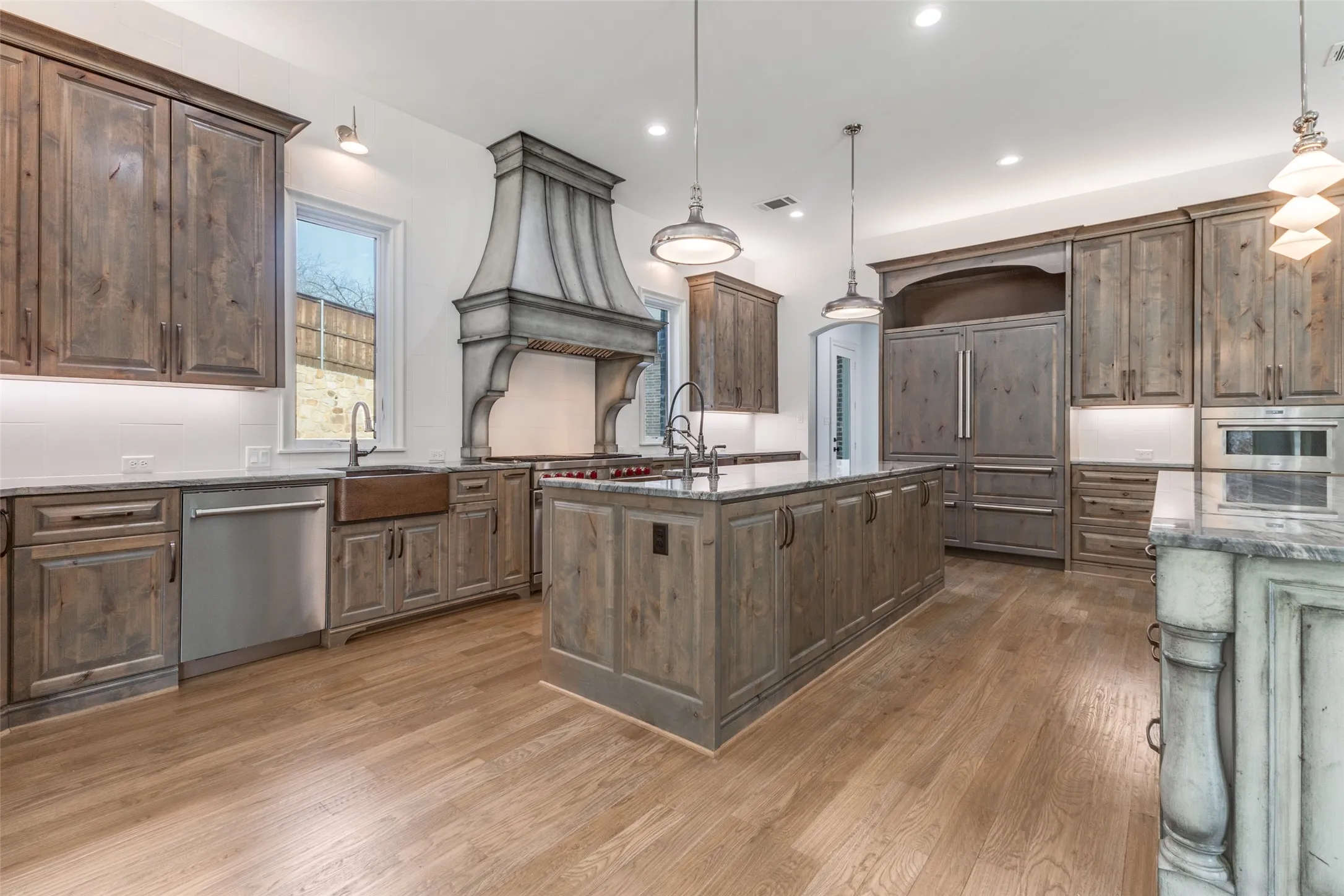 Kitchen featuring quartzite counters, Wolf/Sub Zero/Anko appliances, and three copper sinks.  You will be the envy of every chef you know!