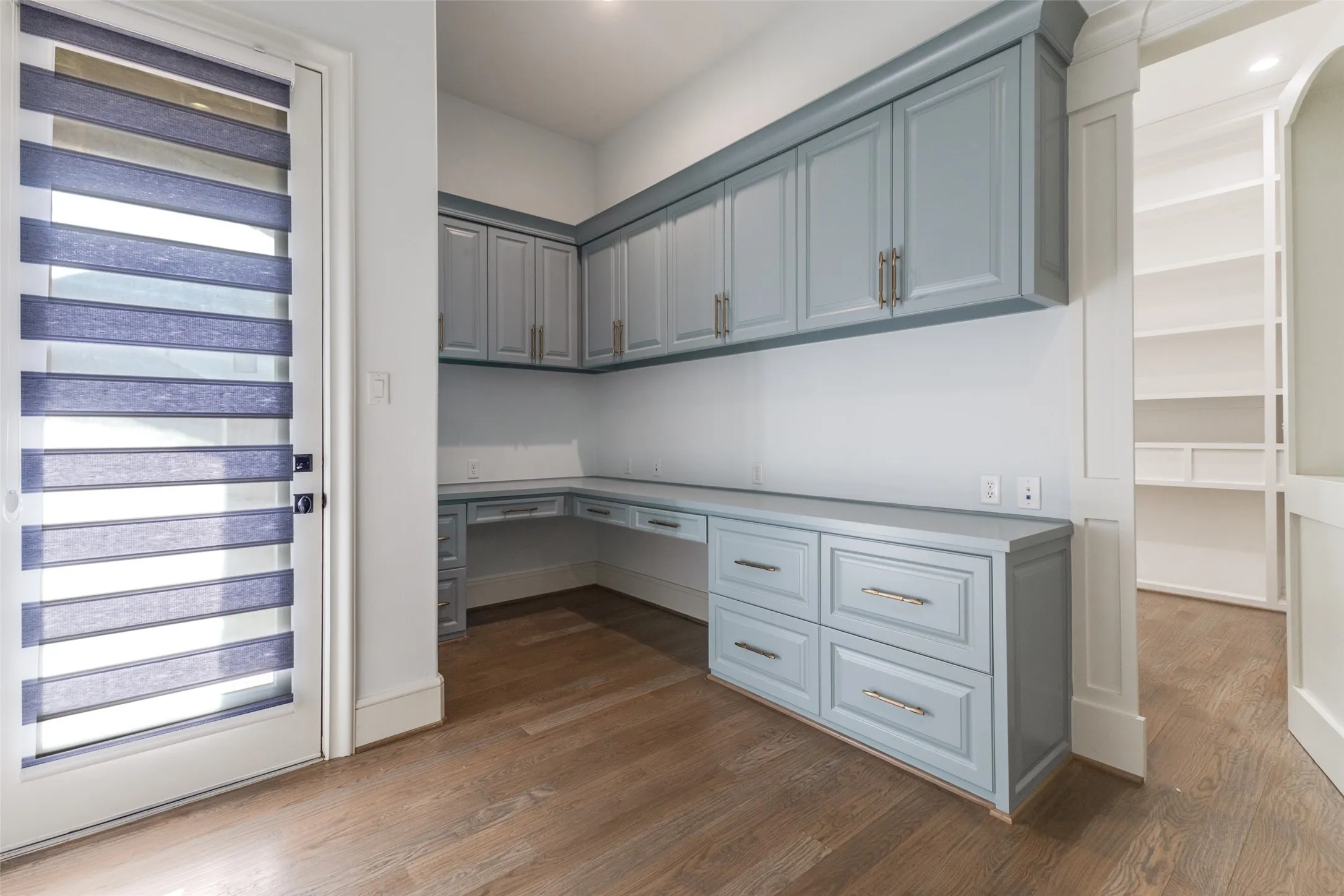 Second office or craft space with a hidden bookshelf door leading to Primary Closet!